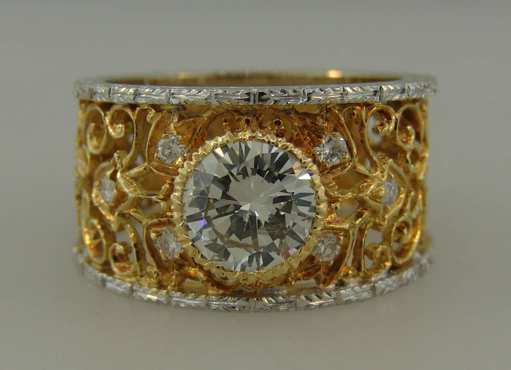 Stunning signature Mario Buccellati lacy band created in Italy in the 1960's. It features an approximately 1.52-carat round brilliant cut diamond framed in 18 karat openwork two-tone gold sprinkled with eight round diamonds. This lacy design is very