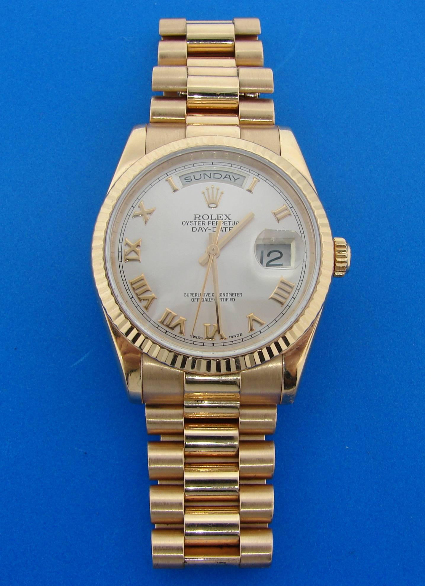 Classy rose gold Rolex Oyster Perpetual Day-Date watch. Hot and desirable, it is a great addition to your watch and jewelry collection.  36 mm case, Swiss made. All parts are original Rolex. One year warranty. Fits up to 9-inch wrist.