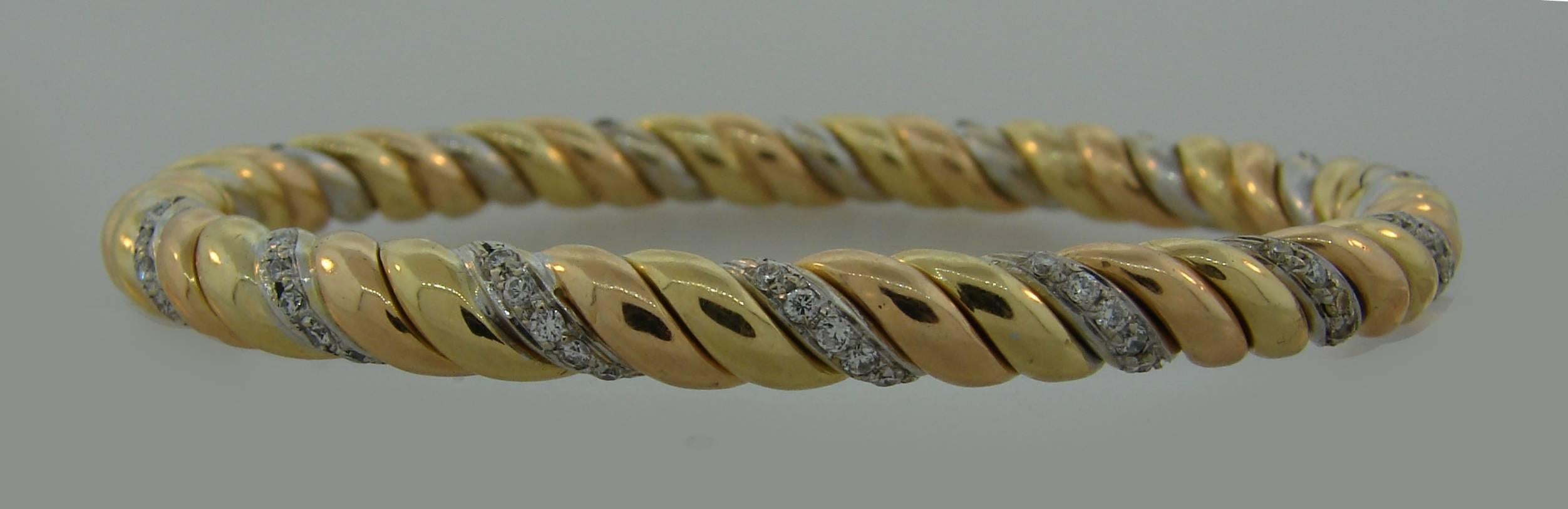 Elegant and wearable bracelet that is a great addition to your jewelry collection. Three-tone gold, white, yellow and rose, makes it practical and combined with any color jewelry that you have. The diamond twist makes the bracelet dressier and