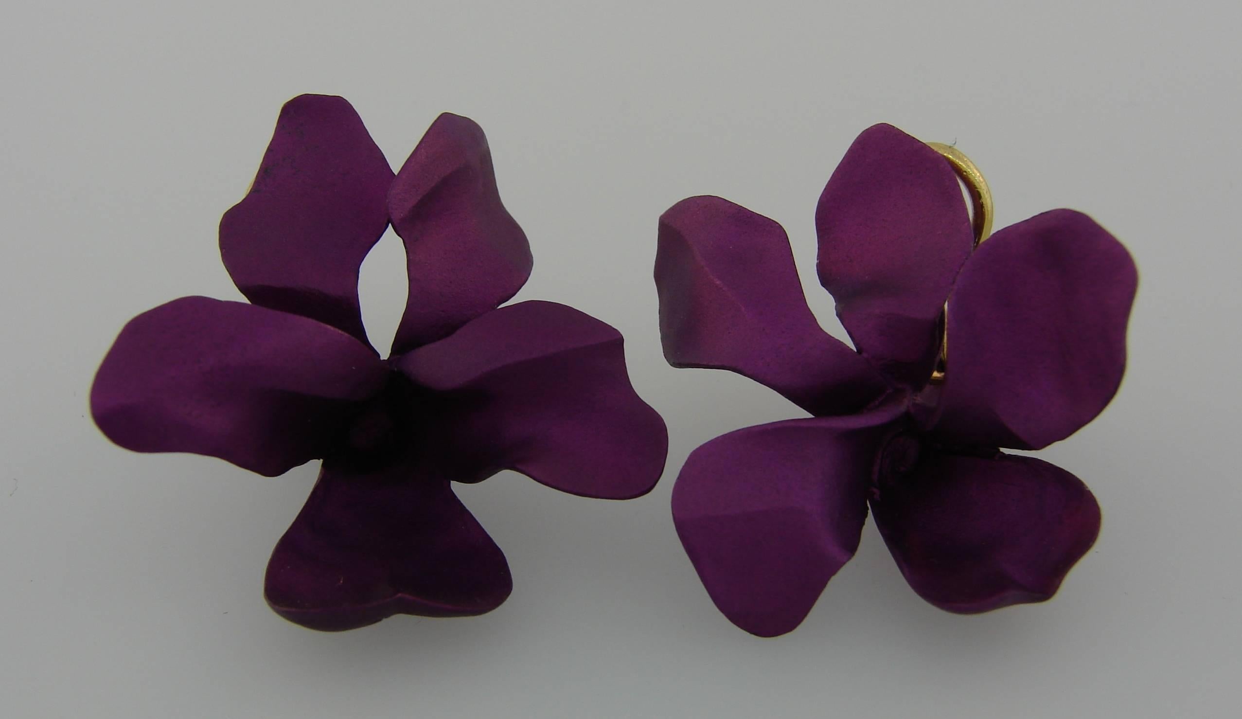 Signature flower earrings created by JAR. Feminine, sculptural, wearable and chic, the earrings are a great addition to your jewelry collection. 
The earrings are made of titanium and have 18 karat yellow gold clasps. They measure 1.25 x 1.25 inches