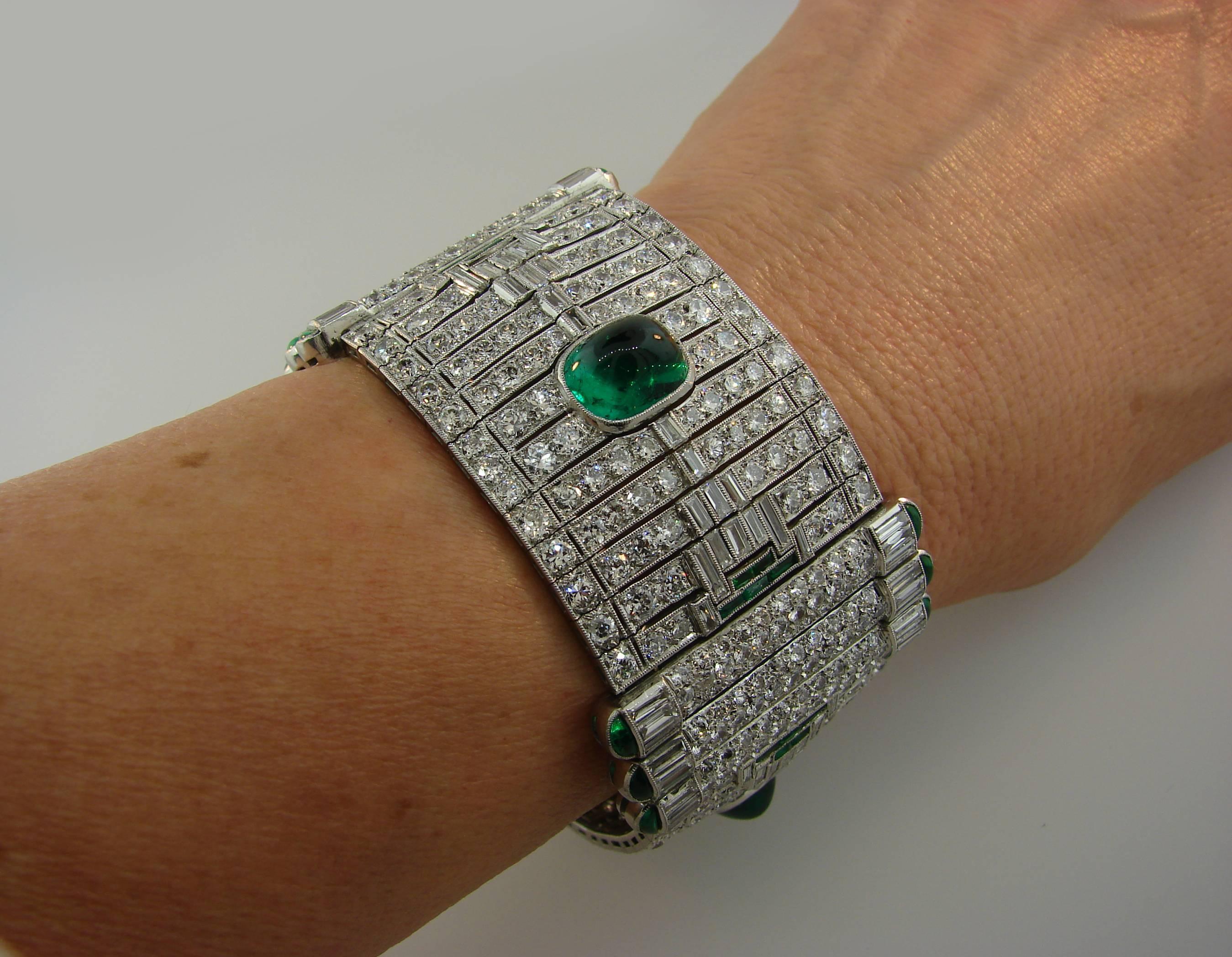 Stunning Art Deco bracelet created by Levy-Wander in the 1930's. It is made of platinum, features three cabochon emeralds and encrusted with round and baguette cut diamonds. The three larger emeralds come with a Gemstone Report from American