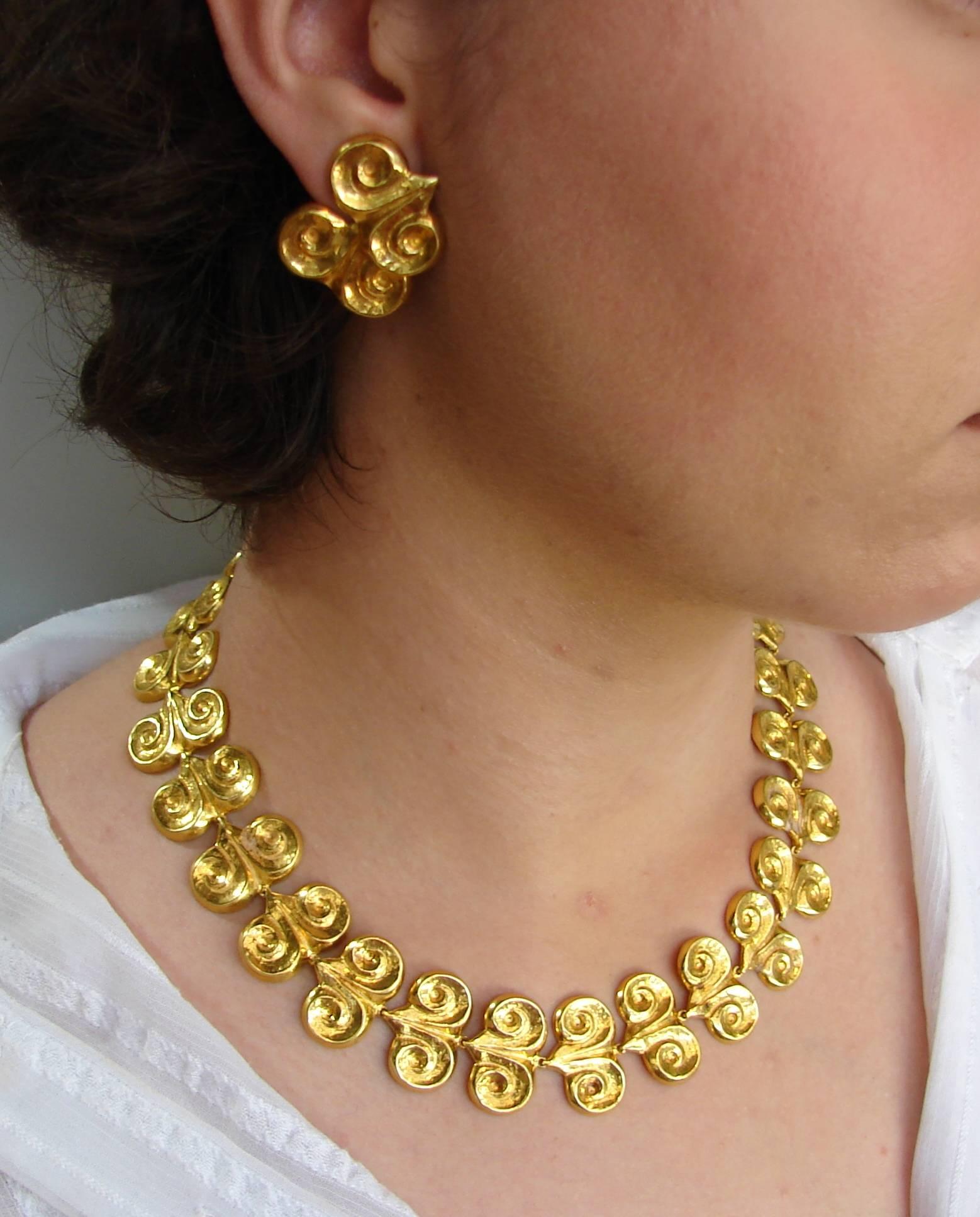 Fabulous set consisting of a necklace and a pair of earrings created by Greek designer Zolotas. Elegant and wearable, the set in a great addition to your jewelry collection. 
Made of 22 karat (stamped) yellow gold. 
The necklace measures 18 x 1