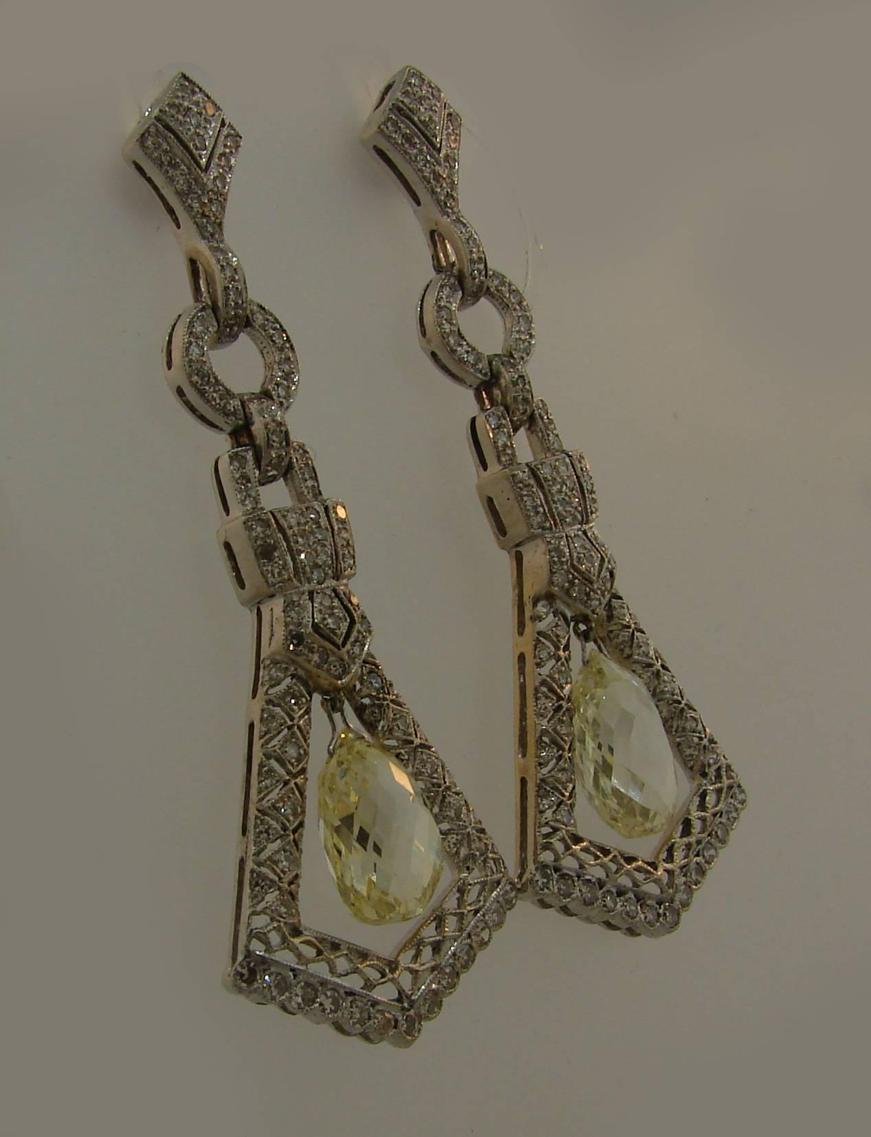 A pair of fabulous dangle earrings featuring two diamond briolettes set in 14 karat (tested) white gold. The briolettes measure 10.91 x 6.92 x 5.10 mm (P color, VS2 clarity) and 11.54 x 7.44 4.92 mm (L color, VS2 clarity). The earrings are encrusted