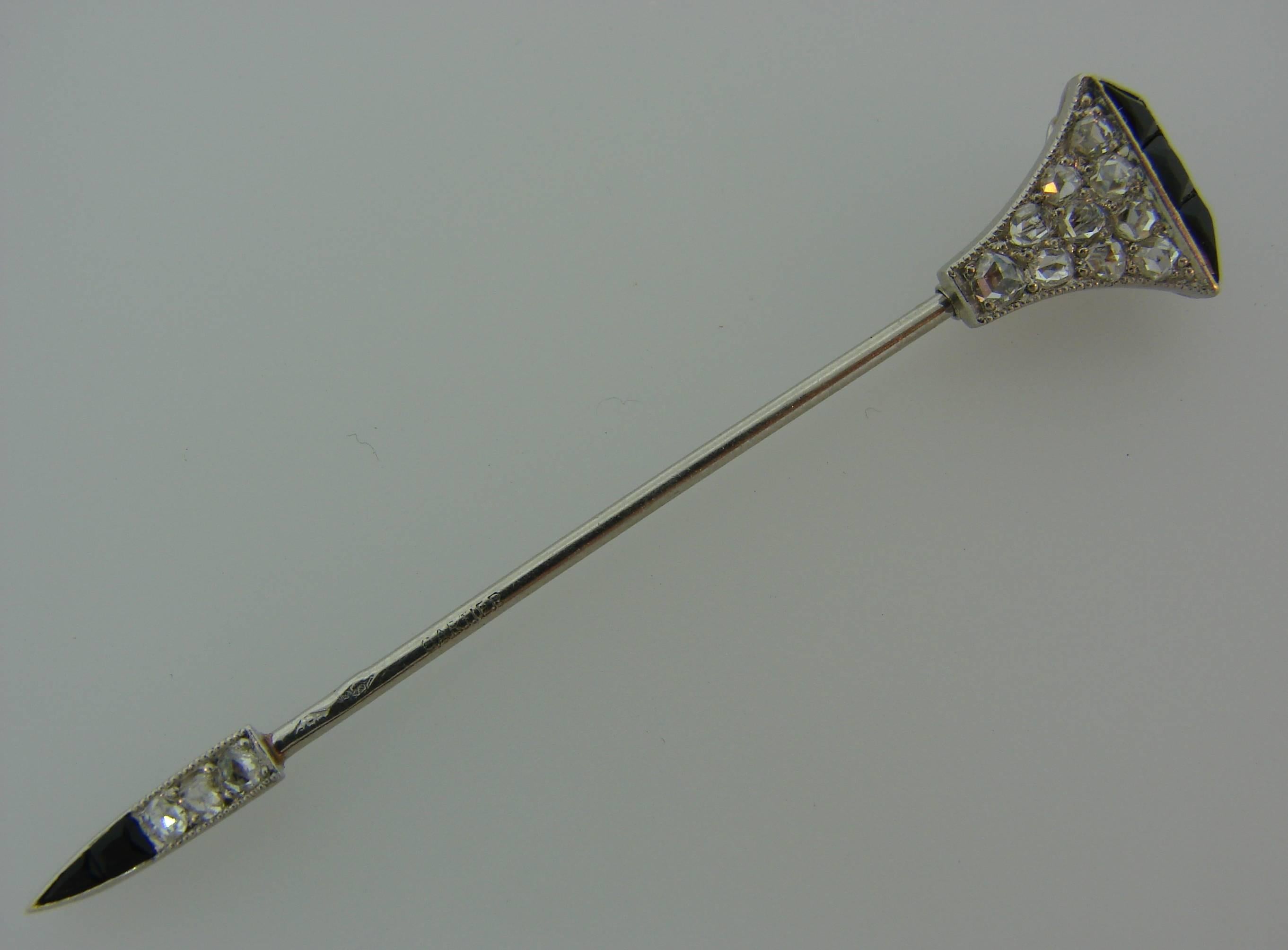 Chic and elegant jabot pin created by Cartier in Paris in the 1910s. Wearable and stylish accent to any outfit, the pin is a great addition to your jewelry collection. 
it is made of platinum and had black onyx and rose cut diamonds accents. 
The