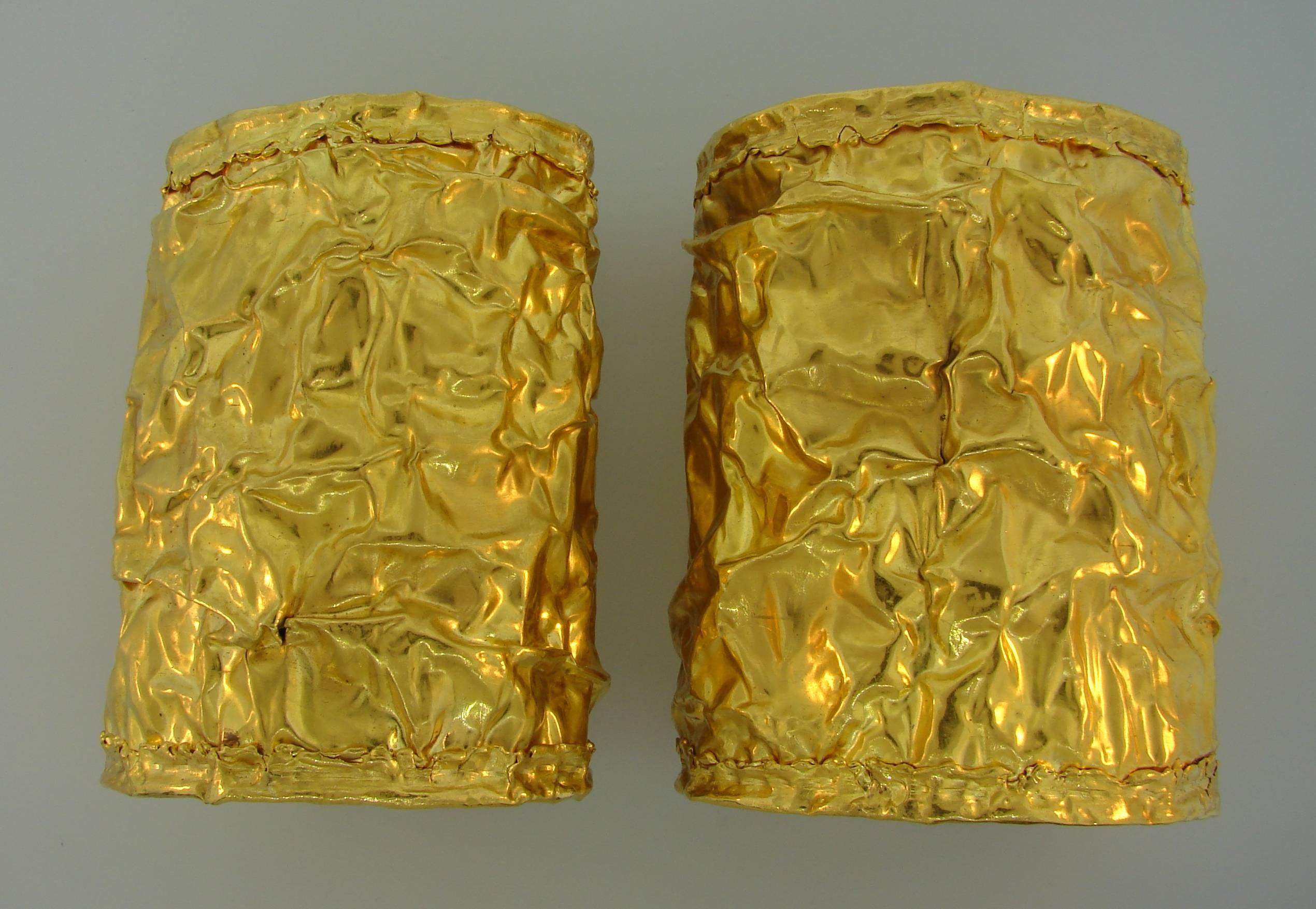 A pair of stunning 22 karat gold cuff bracelets that make your feel like Cleopatra. The cuffs are 3-3/4 inches (9.8 cm) long and weigh 362.2 grams. They would perfectly fit up to 7-inch wrist. 