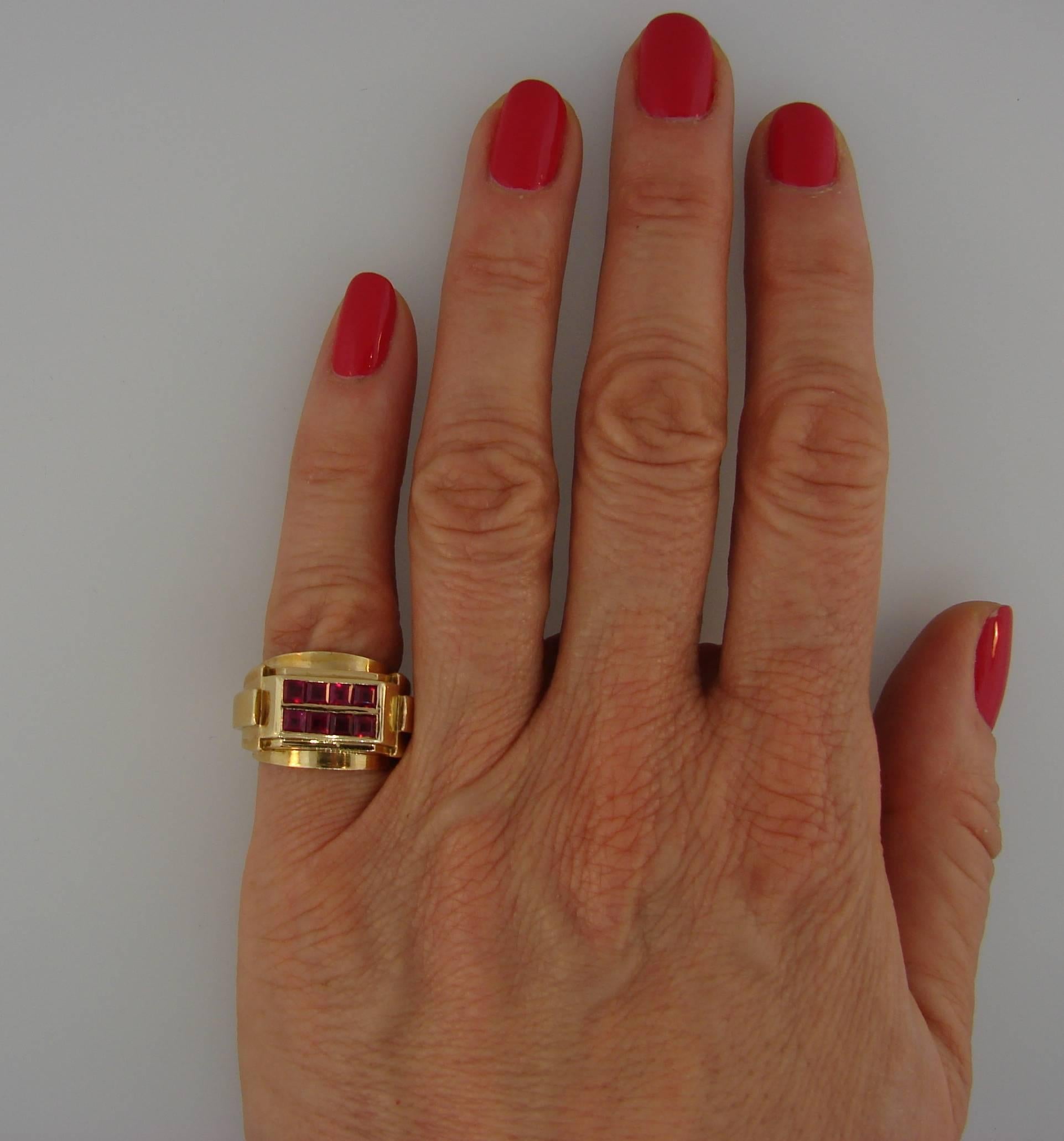 Classy Retro ring created by Rene Boivin in the 1940's. Made of 18 karat yellow gold and set with eight step cut rubies. Strong geometrical design and perfect proportions are the highlights of this ring and make it a chic pinky ring. Elegant and