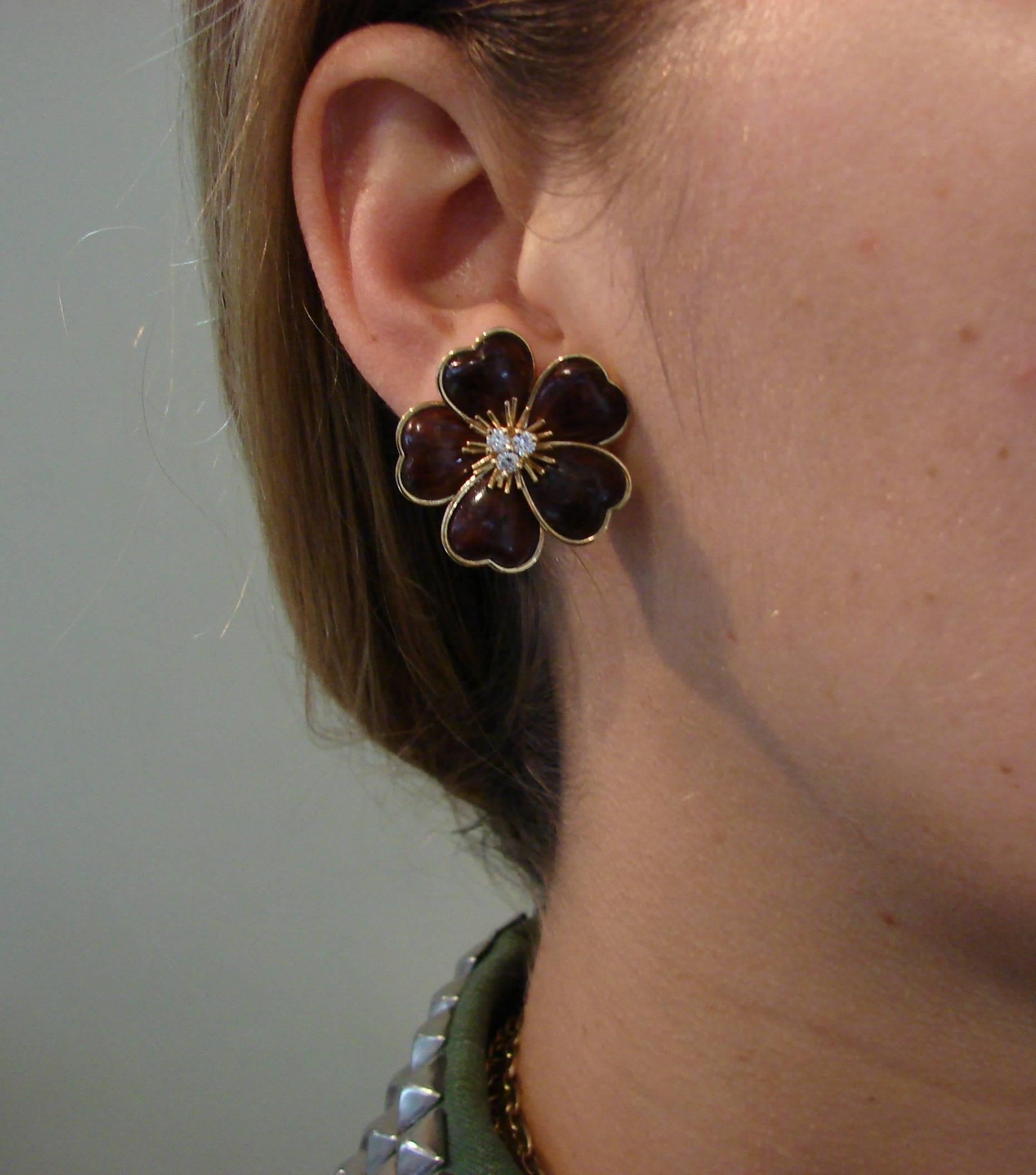 Iconic ear clips created by Van Cleef & Arpels for their Clematis Collection. 
Favorite VCA floral motifs. Medium size - 1 inch (2.6 cm) in diameter.
Feminine, wearable and French chic, the earrings are a great addition to your jewelry