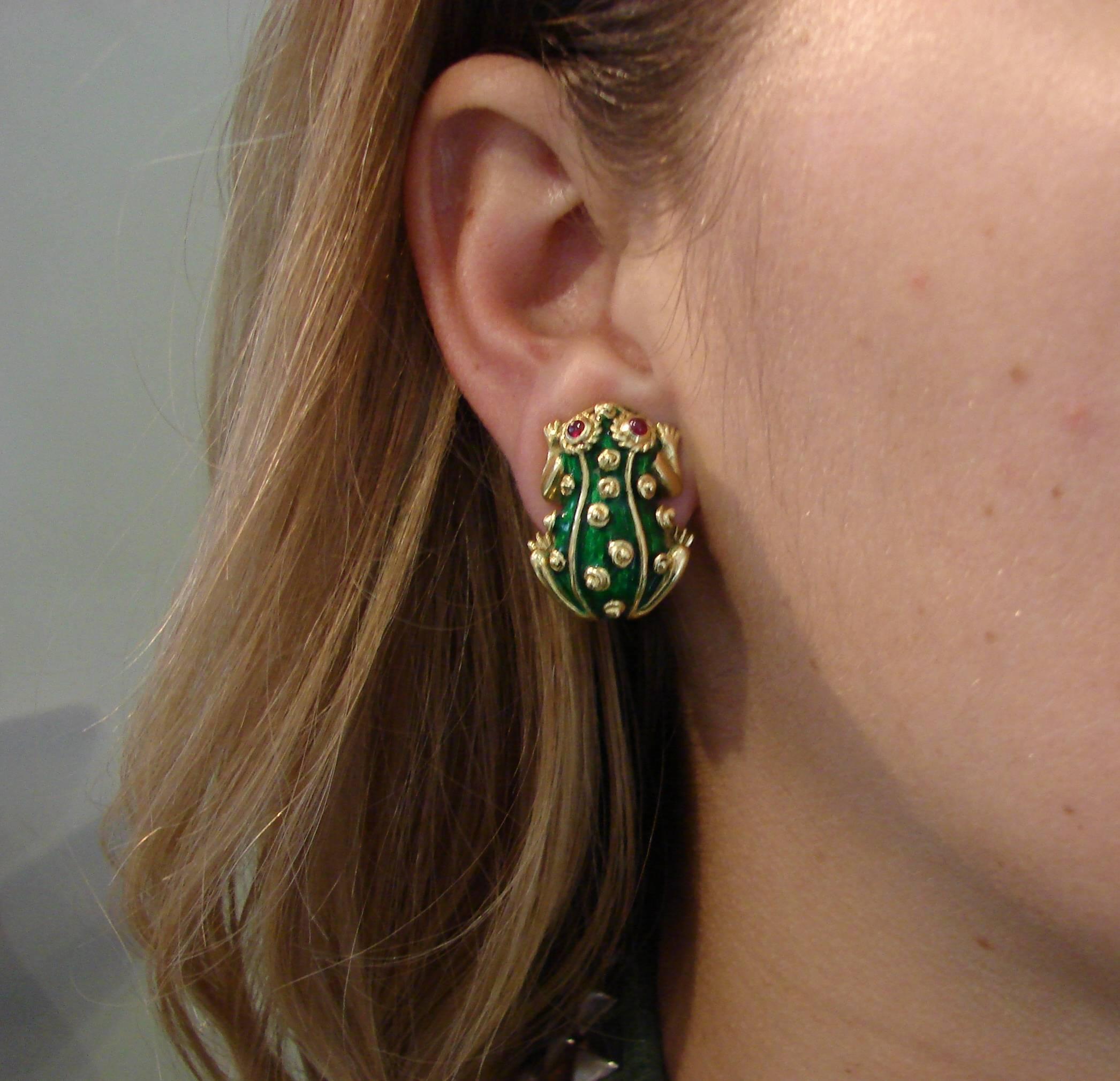 Signature David Webb frog earrings created in the 1980's. Bold and extravagant yet wearable, the earrings are a great addition to your jewelry collection and will accentuate your fun-loving personality. 
Made of 18 karat yellow gold and green enamel