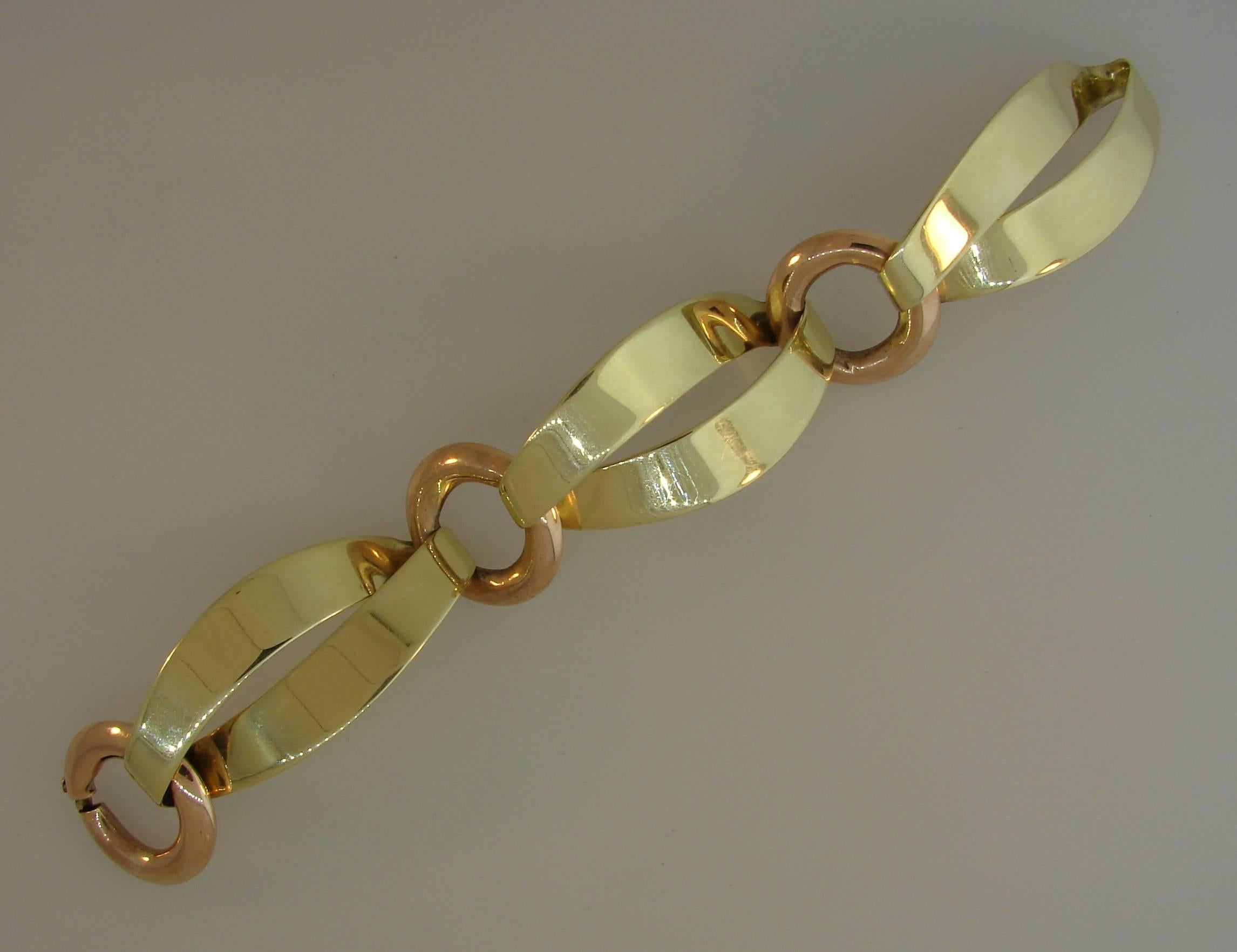 Fun and stylish bracelet created by Cartier in the 1940's. Alternating contrast links, perfect proportions and combination of yellow gold and rose gold are the highlights of this fabulous bracelet. Sharp, elegant and wearable, it is a great addition