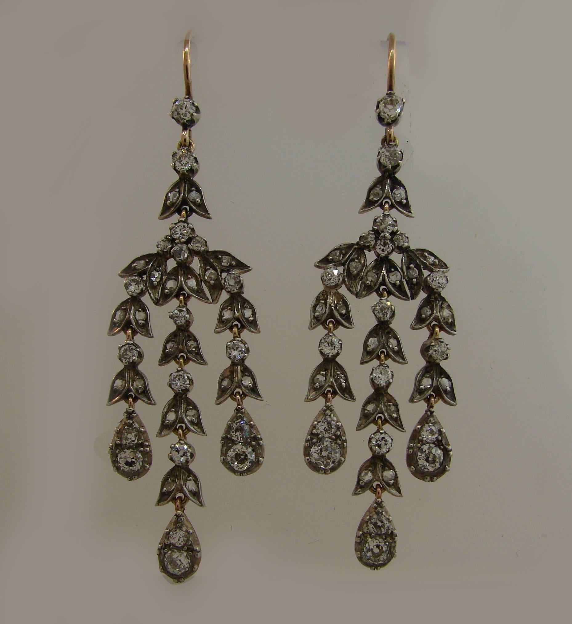 Fabulous Victorian dangle earrings. Classy, timeless, feminine and wearable, they are a great addition to your jewelry collection. 
Made of yellow gold topped with silver and set with old mine and rose cut diamonds (total weight approximately 2.50