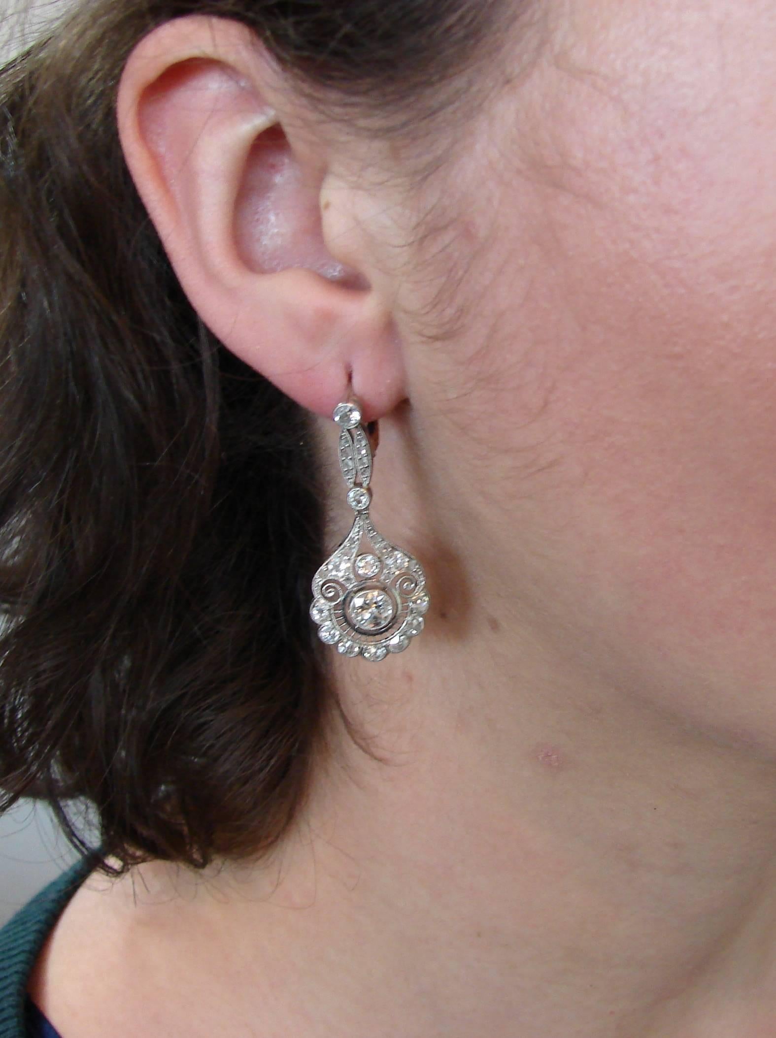 Fabulous Art Deco dangle earrings. Classy, timeless, feminine and wearable, they are a great addition to your jewelry collection. 
Feature two Old European cut diamonds approximately 0.65-carat each set in platinum, encrusted with Old European, mine