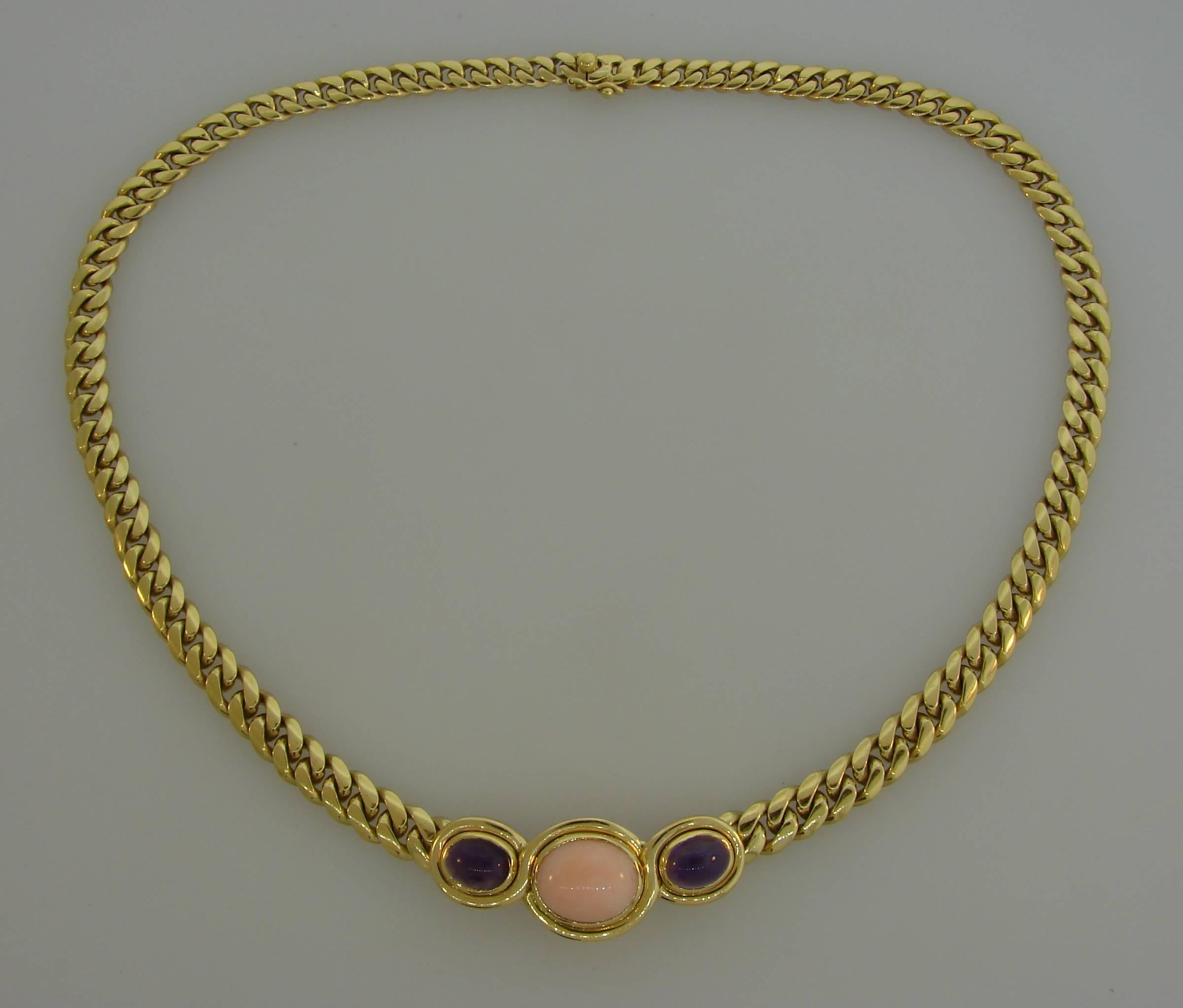 Bold yet elegant necklace created by Bulgari in Italy in the 1980s. Chic and wearable, it is a great addition to your jewelry collection. 
The necklace is made of 18 karat yellow gold and set with an oval cabochon coral and two oval cabochon