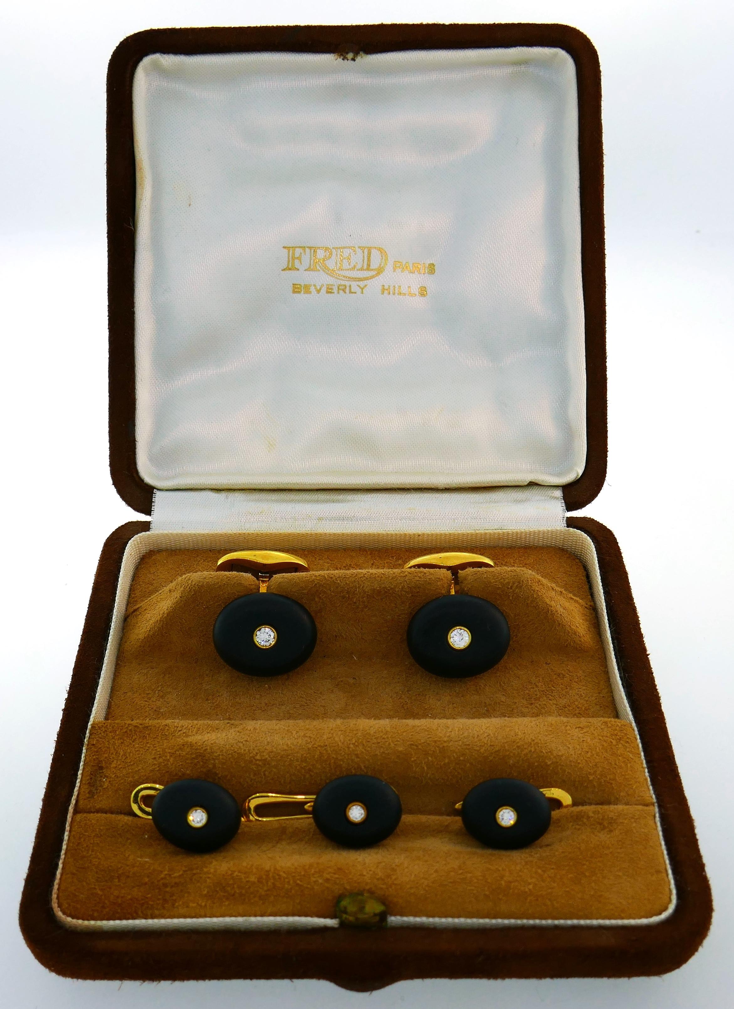 Classy cufflink & stud set created by Fred in West Germany in the 1980's. Elegant and stylish, the set is a great addition to your jewelry and accessories collection. 
Made of 18 karat (stamped) yellow gold, black jet and accented with diamonds