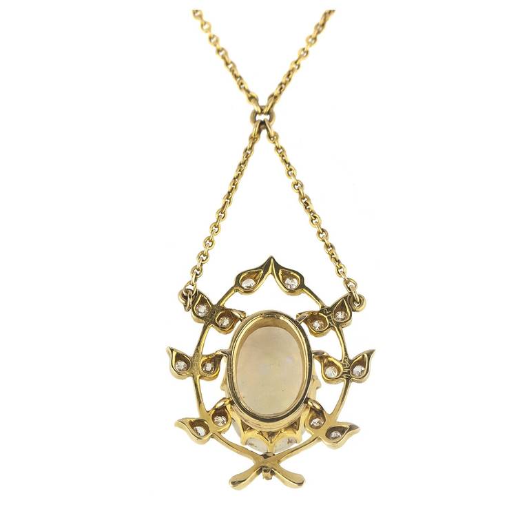 An antique gold necklace, comprising an oval opal with wonderful colour to the centre, accentuated by old cut diamonds. 

The pendant is stamped 15ct and has been tested as 15ct gold. 

Circa early 1900s. Total length of necklace including drop