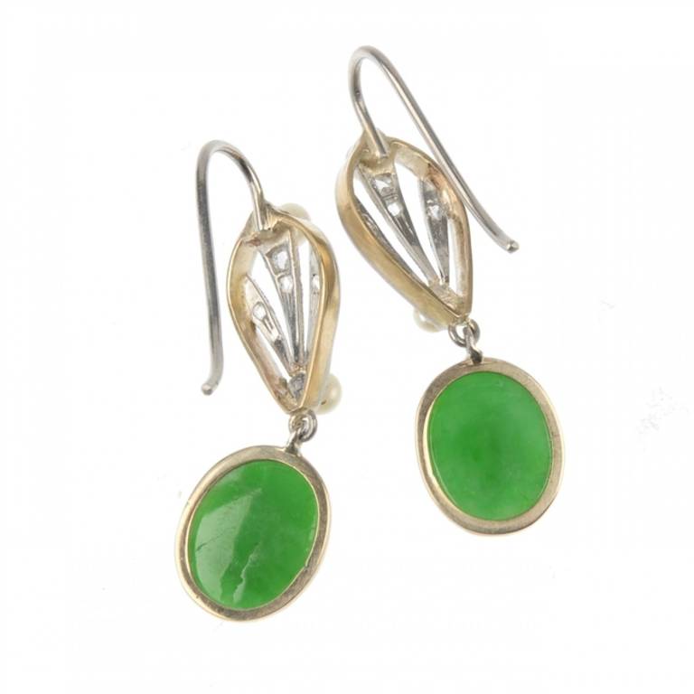 A pair of late Victorian/early Edwardian 9ct gold platinum fronted jadeite, diamond and natural pearl drop earrings each comprising an oval jade cabochon, suspended from a rose-cut diamond openwork pear-shape panel with oriental salt water pearl