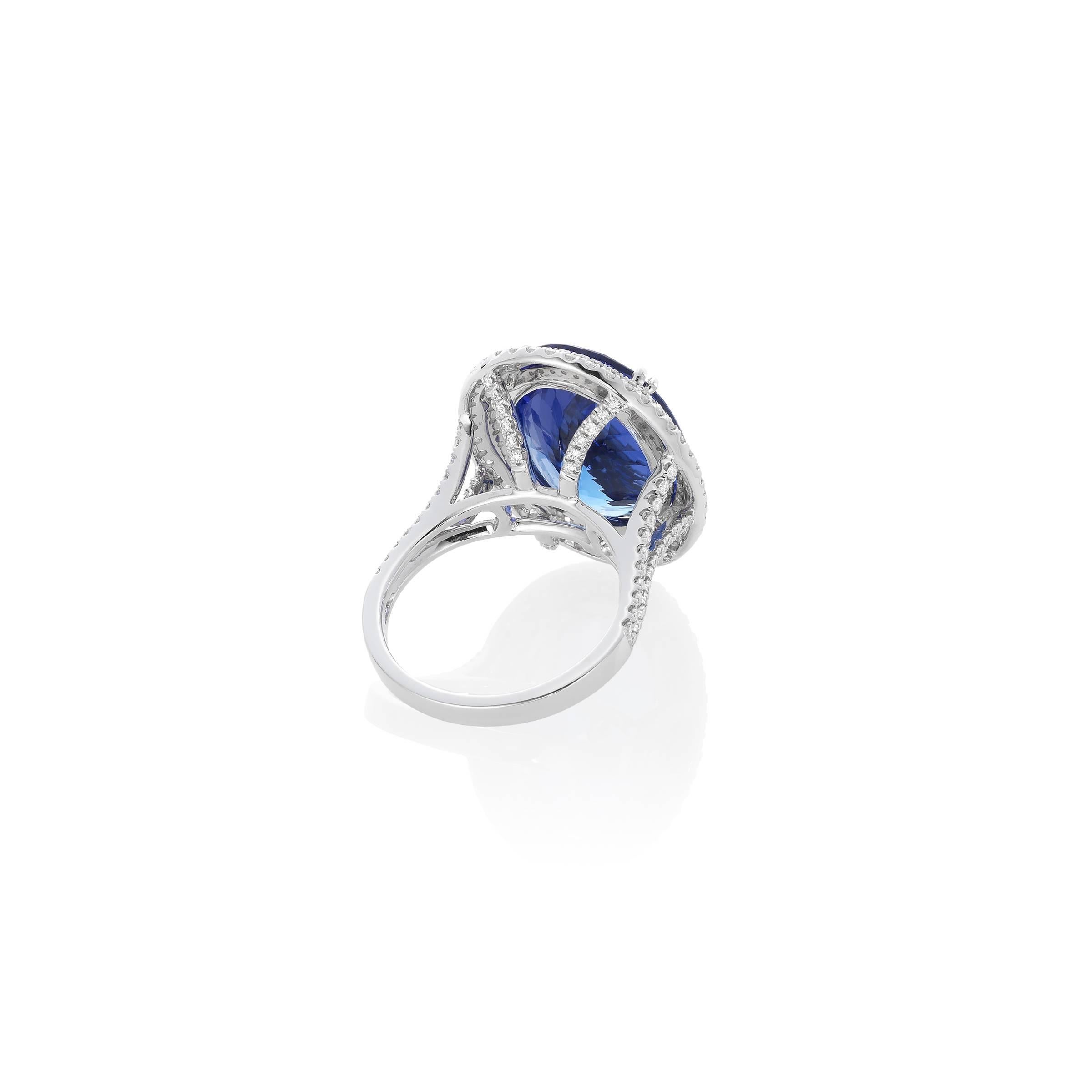 18K White Gold with Oval Tanzanite and Diamond Right Hand Ring.  
3.74 CTW Oval Tanzanite with 156 Round Diamonds