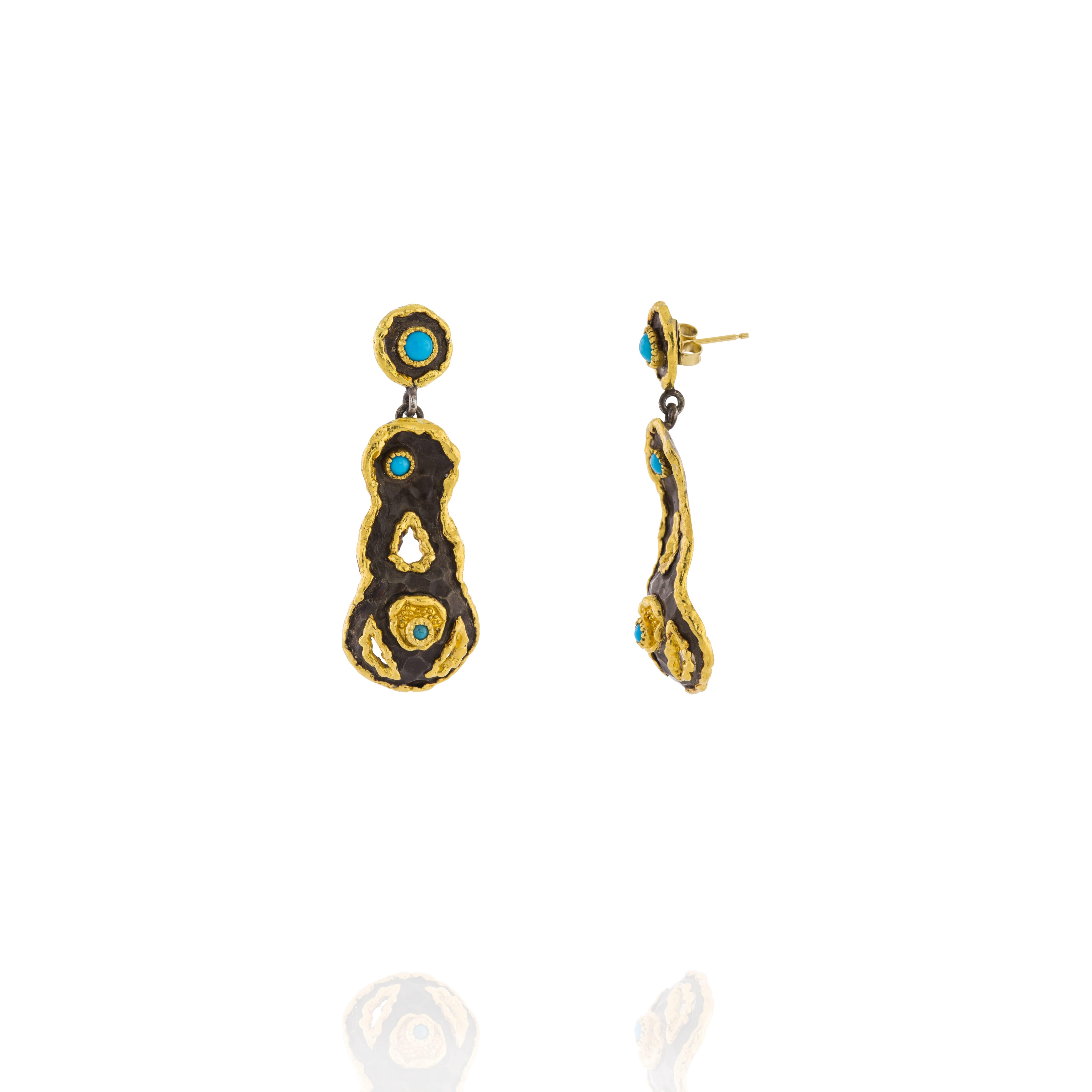 Earrings designed and made by Victor Velyan with his proprietary brown patina.  They contain 6 Turquoise stones.  The earrings are made with a Sterling Silver base and all accent work is done in 24K Gold. The brown patina is hand painted and bonded