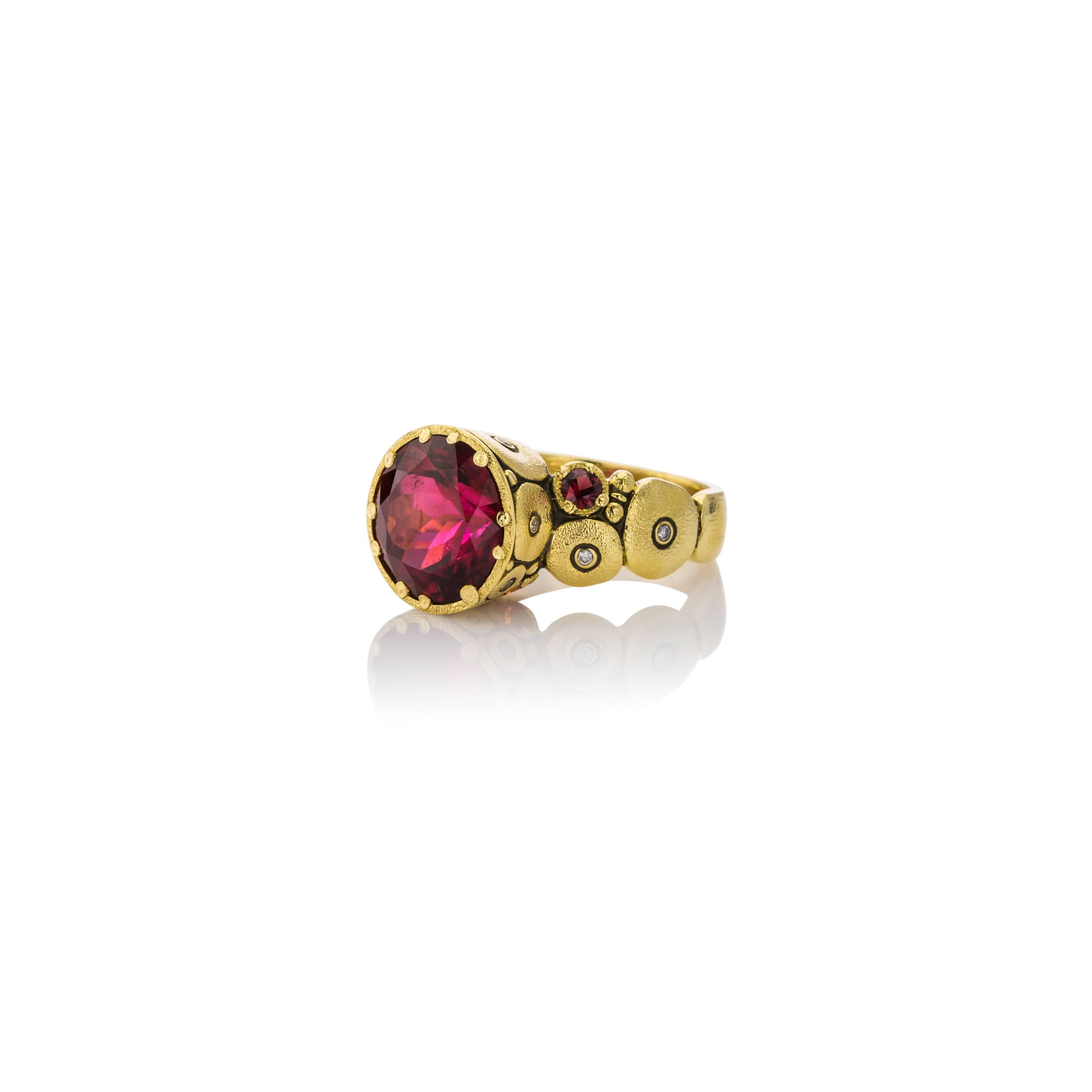 Stunning Alex Sepkus Ring in 18kt Yellow Gold. Center bezel set 7.04ct Red Tourmaline, .50cts bezel set diamonds and.16ct red bezel set sapphires.  Finger Size 7.  Can be sized to fit. 