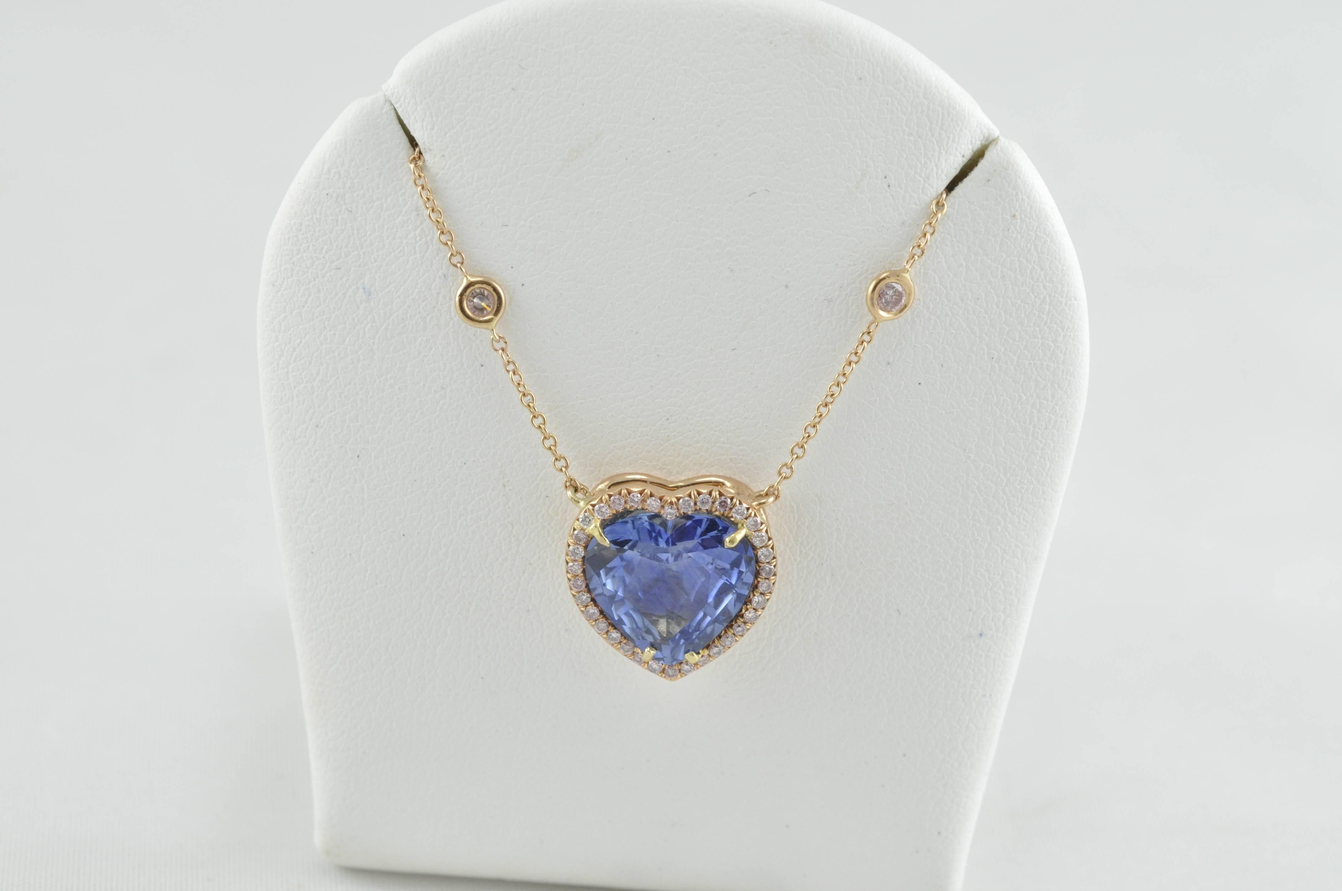 Beautiful 14K Pendant.  4.5 carats Sapphire with .65 carats Pink Diamond.  Custom made natural Ceylon Sapphire. 16 inch rolo rose gold chain with 6 bezel set diamonds.  34 melee diamonds around the sapphire.  