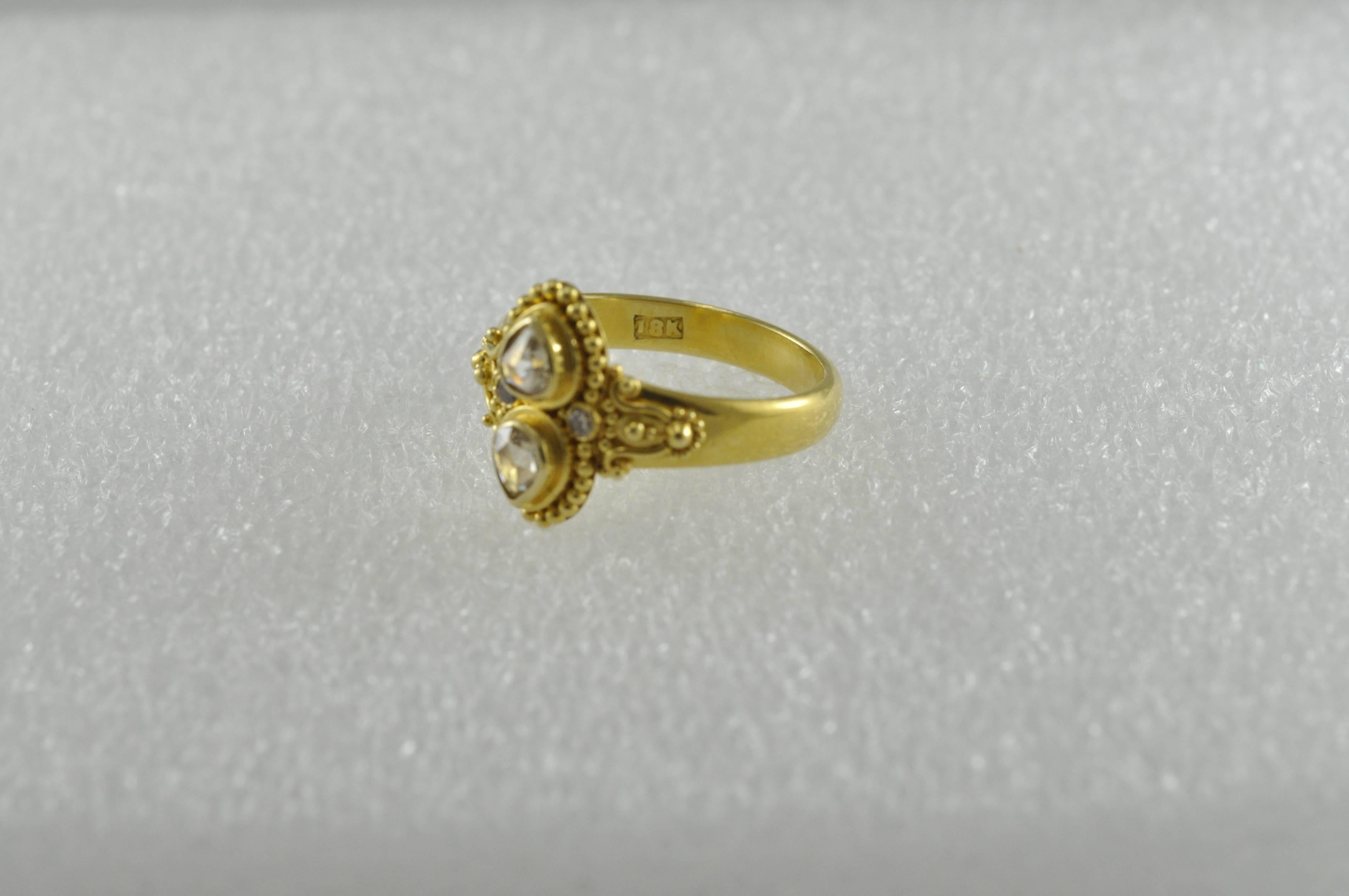 Dainty, gorgeous ring from Kimarie.  18K Gold Champagne Diamond Ring.  
6 3/4 finger size, we can size to fit. 18kt/22kt. Gold – bezel set rose cut champagne colored bezel diamonds with two round full cut melee diamonds on either side, .30cts.