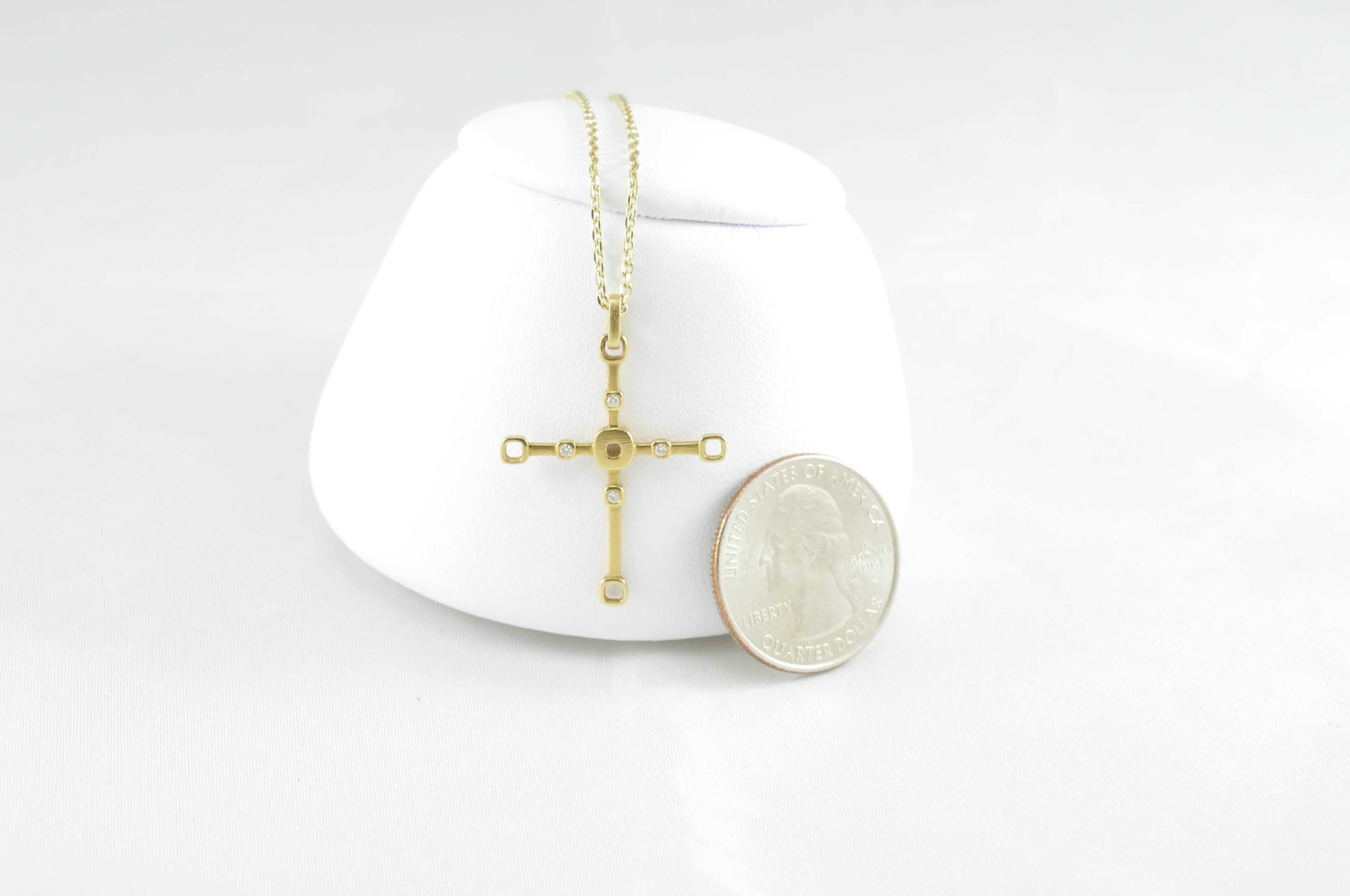 Alex Sepkus 18K Gold and Diamond Cross Pendant on 14K Gold Chain. 
18kt. Sepkus cross
Four round diamonds .06cts
Textured finish.
