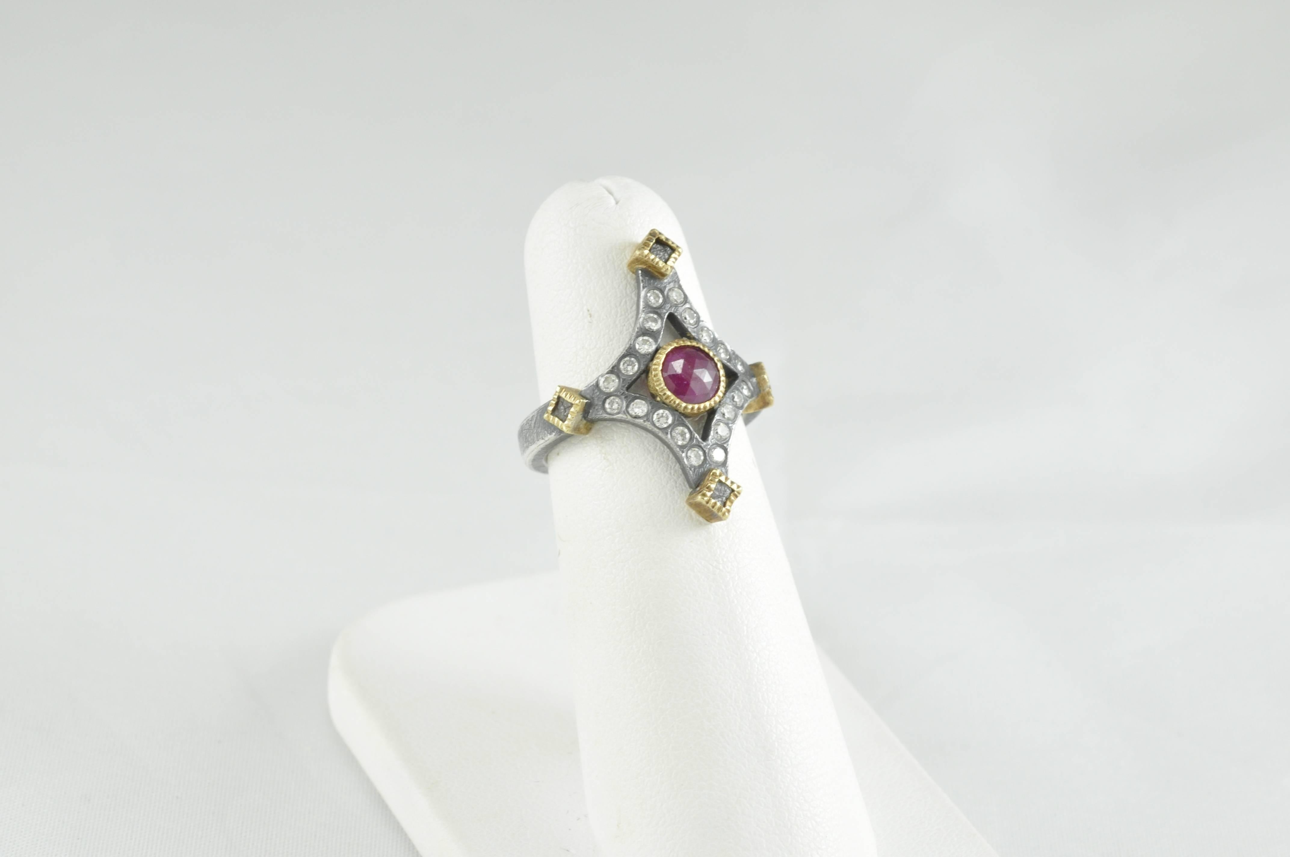 Model Number tdr801-ruby.

18k Yellow Gold, Sterling Silver with patina Ring.   
Ruby-.33ctw.  White Brilliant Cut Diamonds .3ctw, Raw diamonds .4ctw.  Hand Forged and Fabricated.  20 each 1.8mm round Diamonds and 4 each raw diamonds. 
Finger size 4