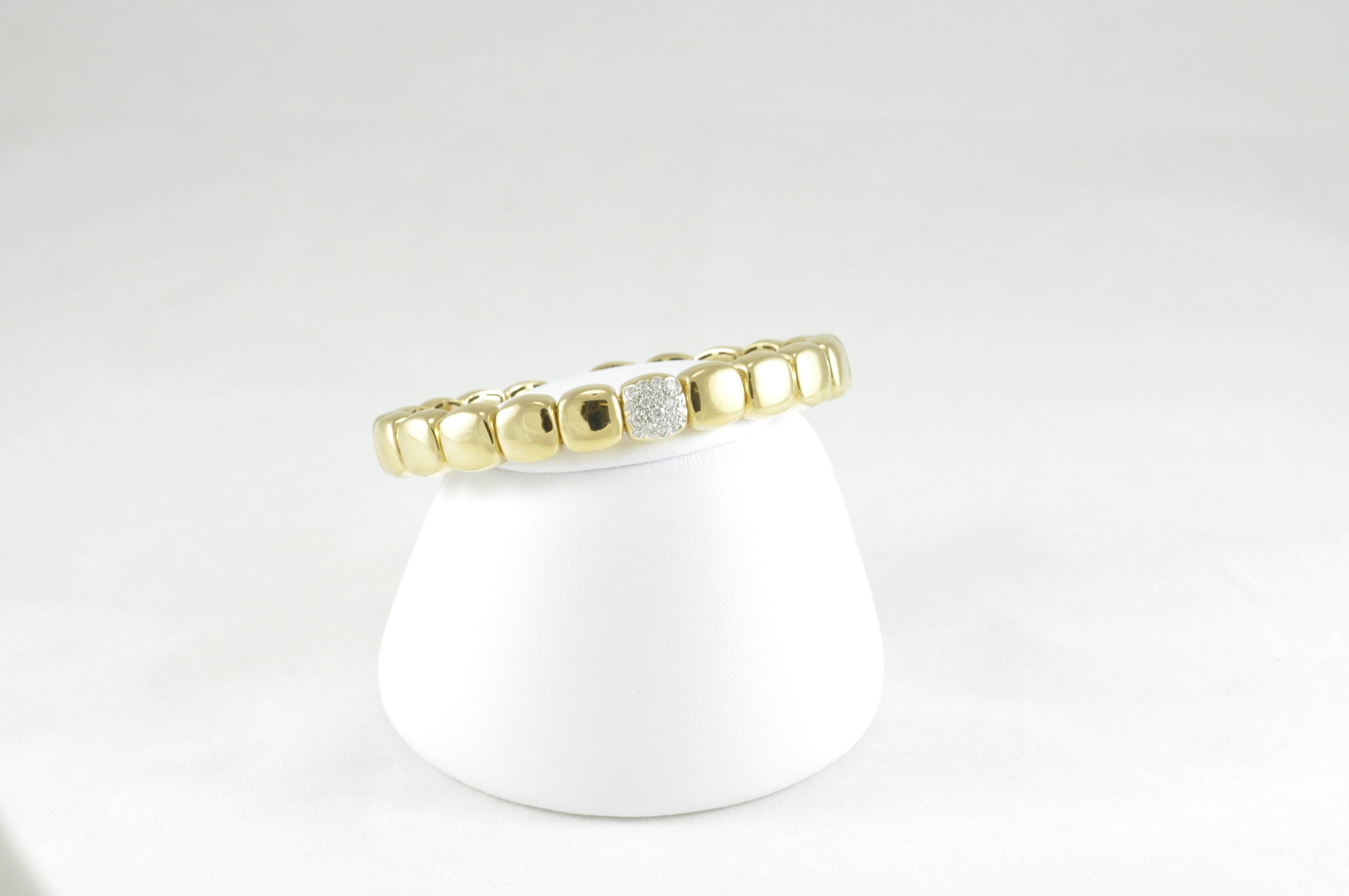 18k yellow gold with diamonds set in white gold. Spring Gold allows for back of bracelet to easily open and close without clasp. Chic bracelet made in Italy by acclaimed designer Antonio Papini. 