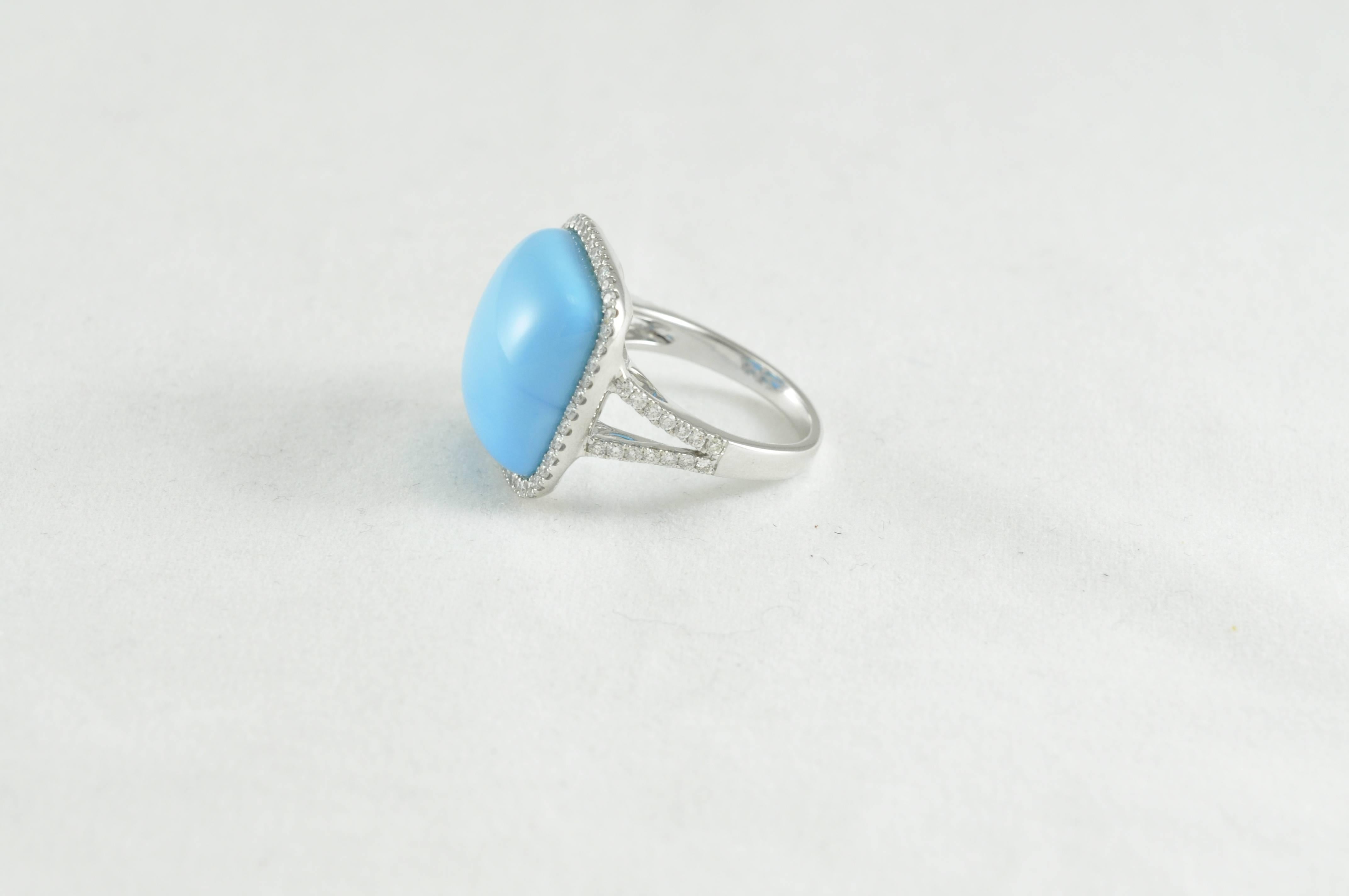 Modern Sleeping Beauty Turquoise Ring Surrounded by Round Diamonds