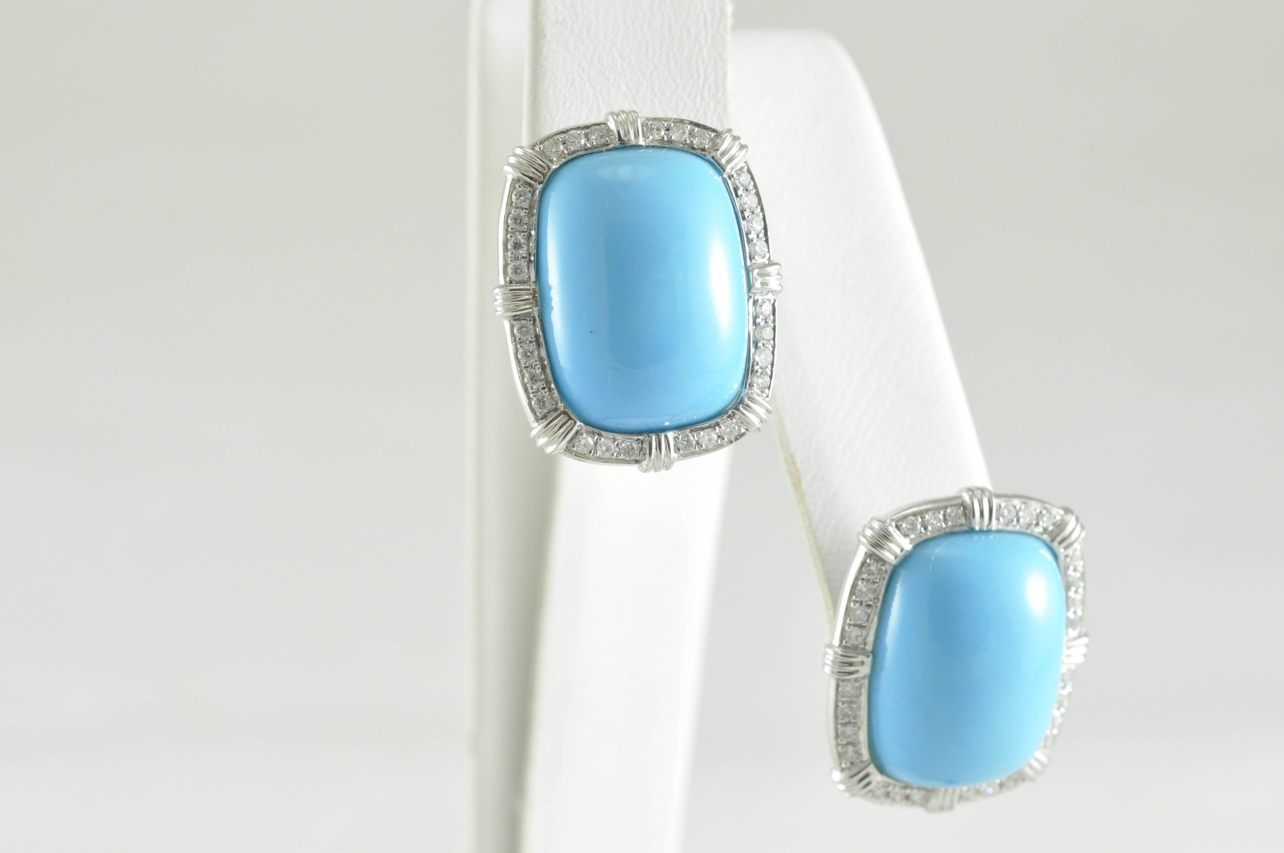18k Natural Arizona Turquoise surrounded by round diamond earrings. The earrings are stamped 18k and 750. Weight of 5.2 grams is per earring.