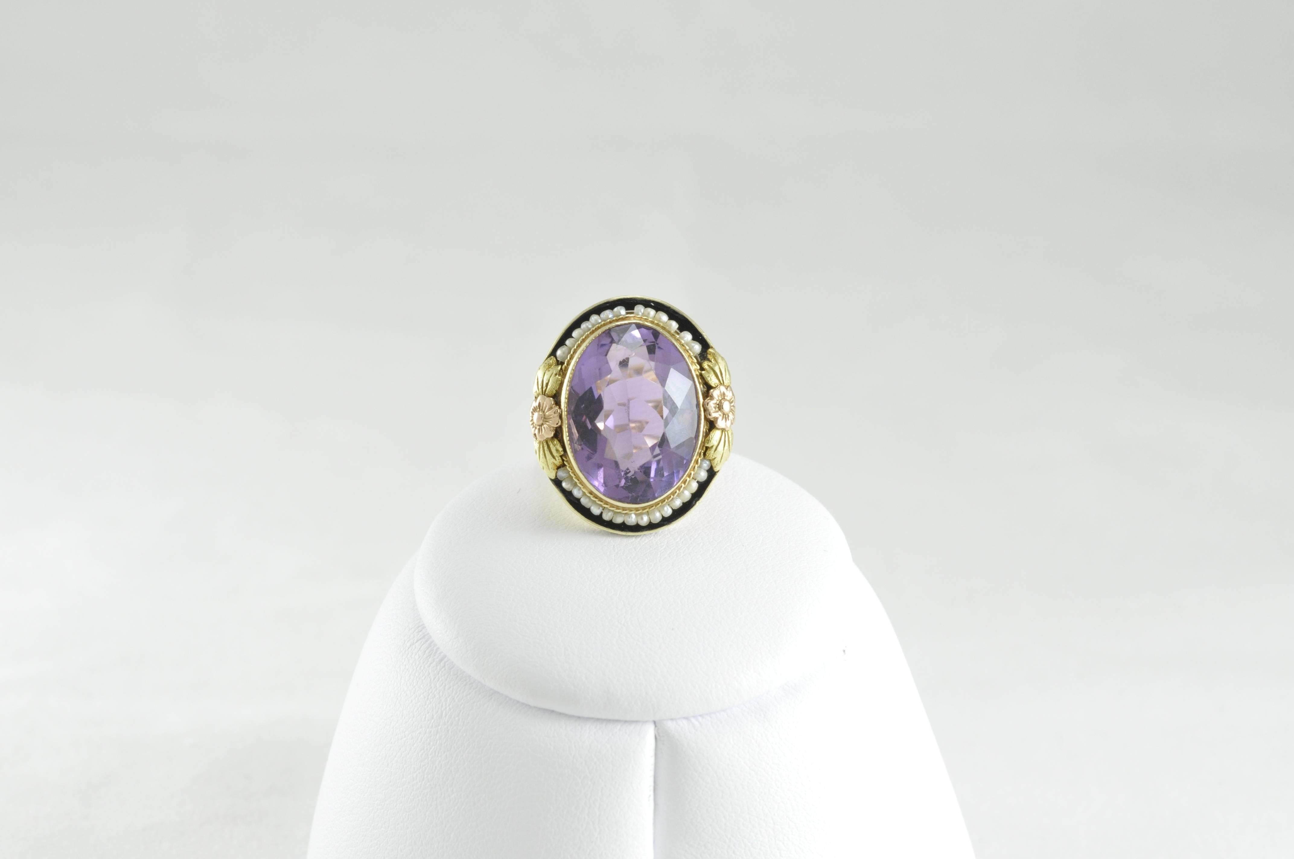 Beautiful Vintage 14k Yellow Gold Oxidized Seed Pearl Ring 
Amethyst Stone. 
Size 6
Rose Gold Detail 
Amethyst is approximately 8.5 carats.  14k yellow and Rose Gold with Painted Enamel.  Medium to Good Condition, missing one pearl.  
