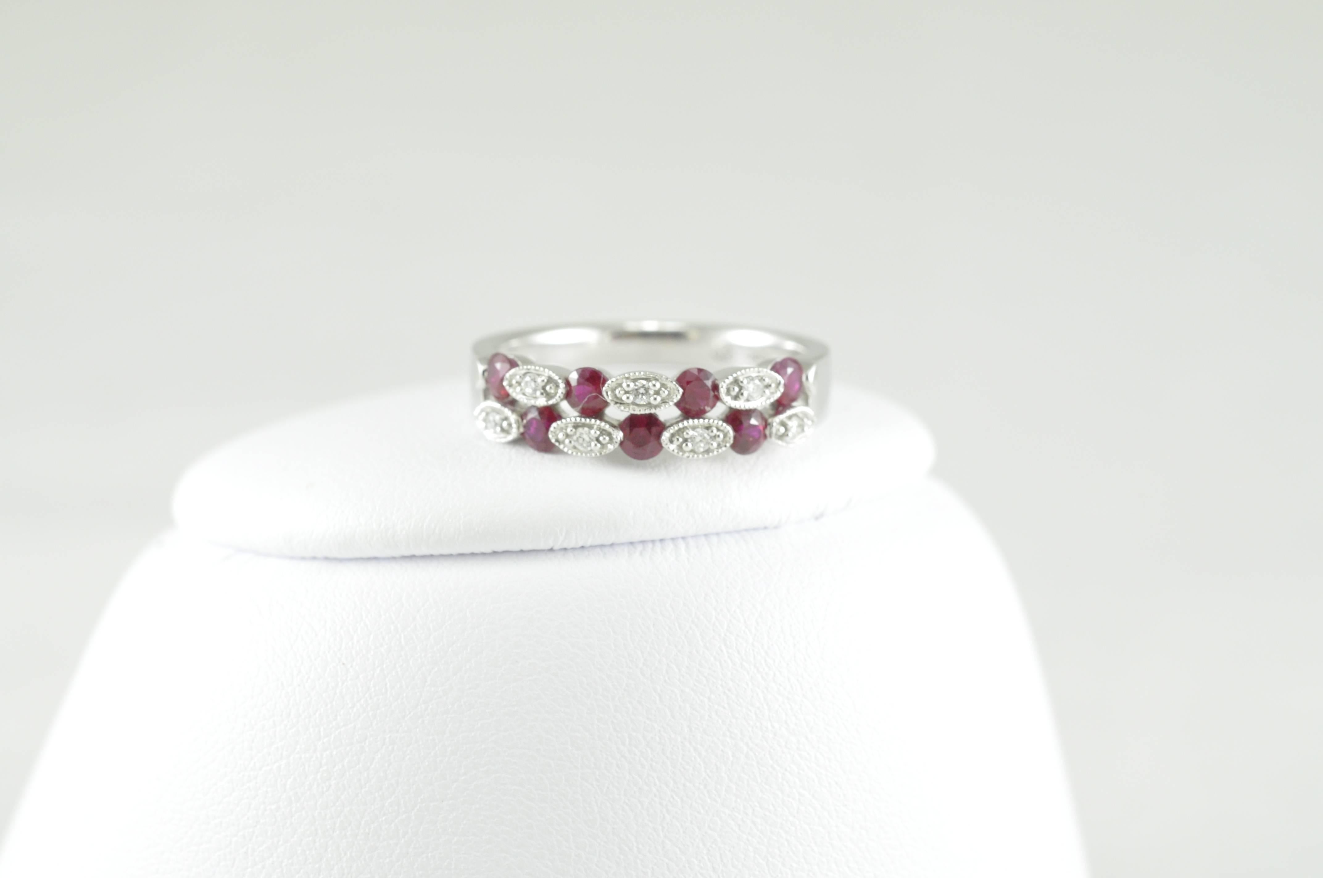 Beautiful Ring by Jewels by Jacob.  This amazing ring is made in 18k band with .06CT Diamonds and .69CT Rubies.  Size 6.5 and can be sized.  Skibell Fine Jewelry will size and ship for free! 