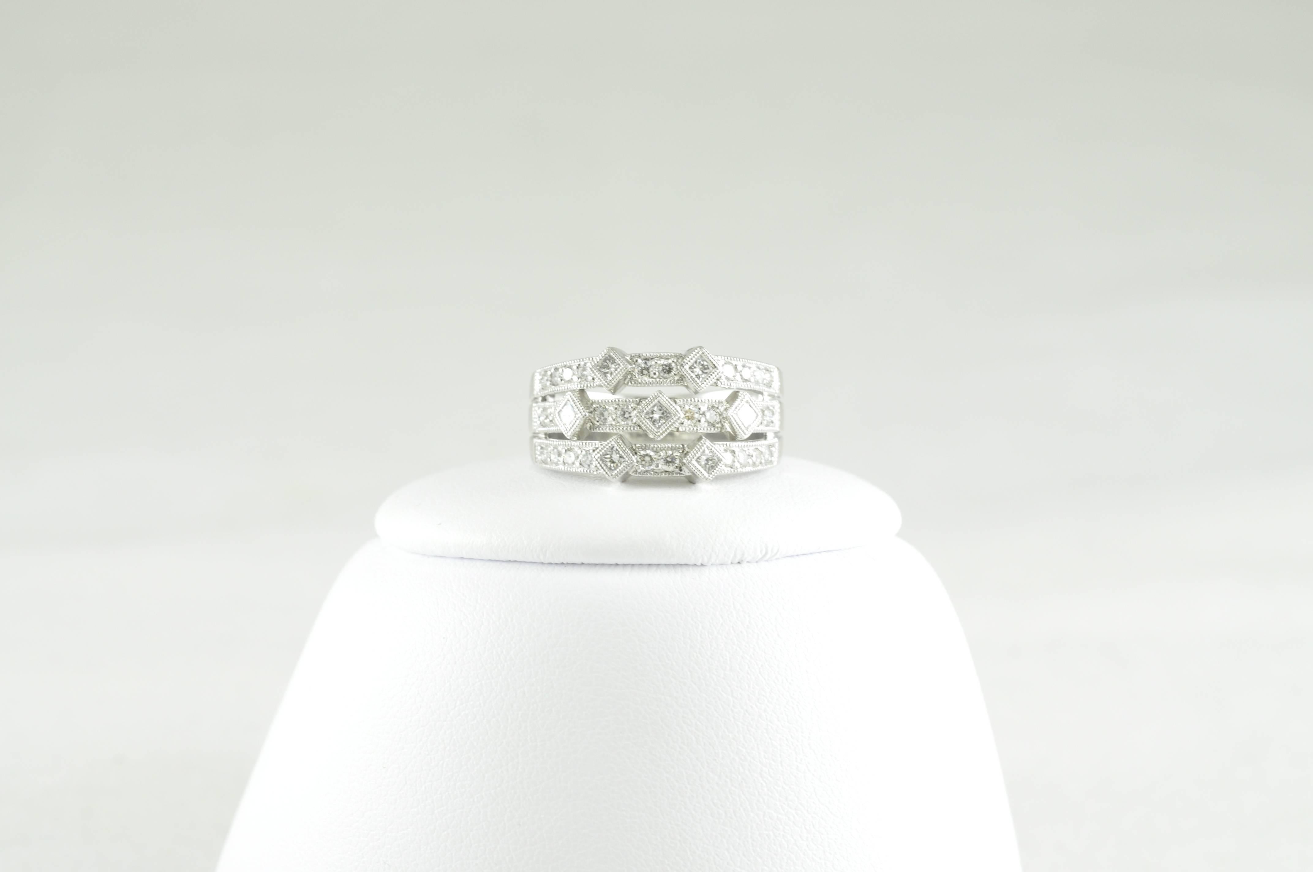 Platinum and Diamond Ring with .45CT Round and .19CT Princess Cut Diamonds.  Made by Award Winning Designer, Jye's!  Exquisite Design. Diamonds are F-G Color V/S1 Clarity.   Size 6.5 but can be sized. 