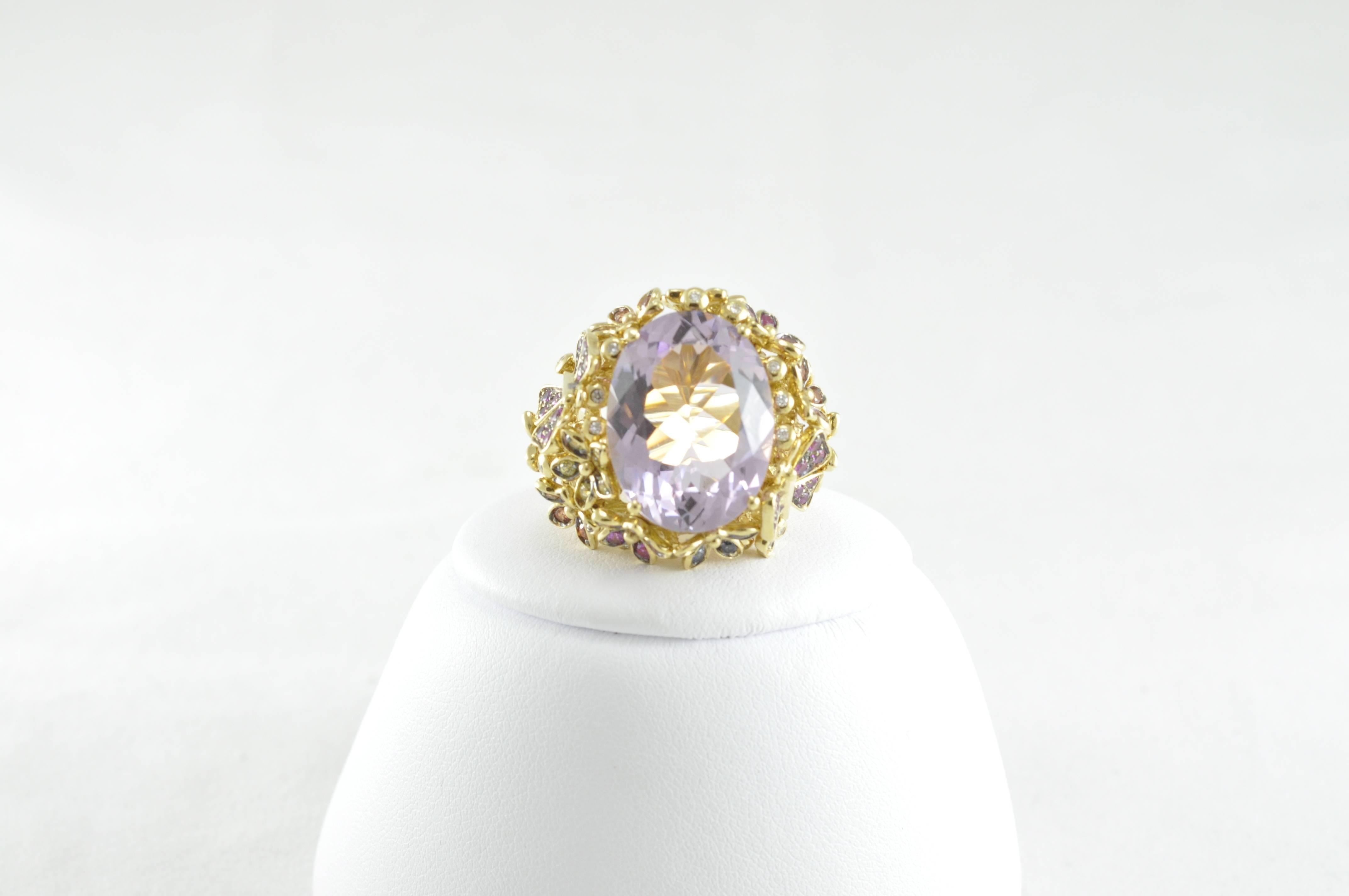 ORIANNE COLLINS Yellow Gold Amethyst Ring with White Diamonds and Multi Color Sapphires.

This ring contains 22g of Yellow Gold; 15.50ct Amethyst .13ct White Diamonds, 1.90ct Multi Color Sapphires.  

A portion of all Orianne Collins Jewelry Sales