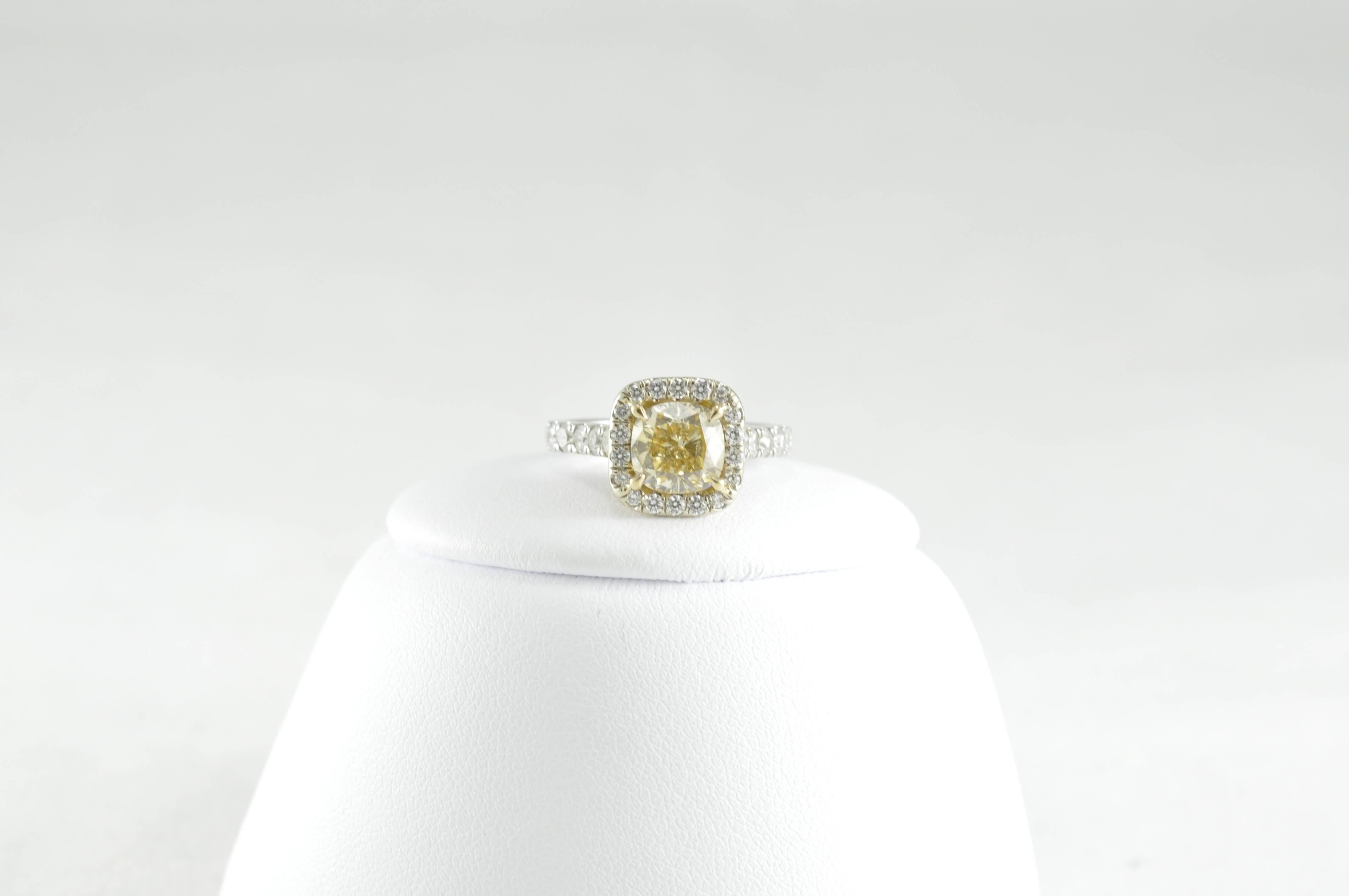 14k White Gold with 2.01ct Yellow Cushion-cut Diamond surrounded by 1.25ct of Round White Diamond Engagement Ring. The center stone measures 7mm x 7mm. The piece is currently a size 4.75 but could be sized.
Absolutely stunning! Not one that you'll