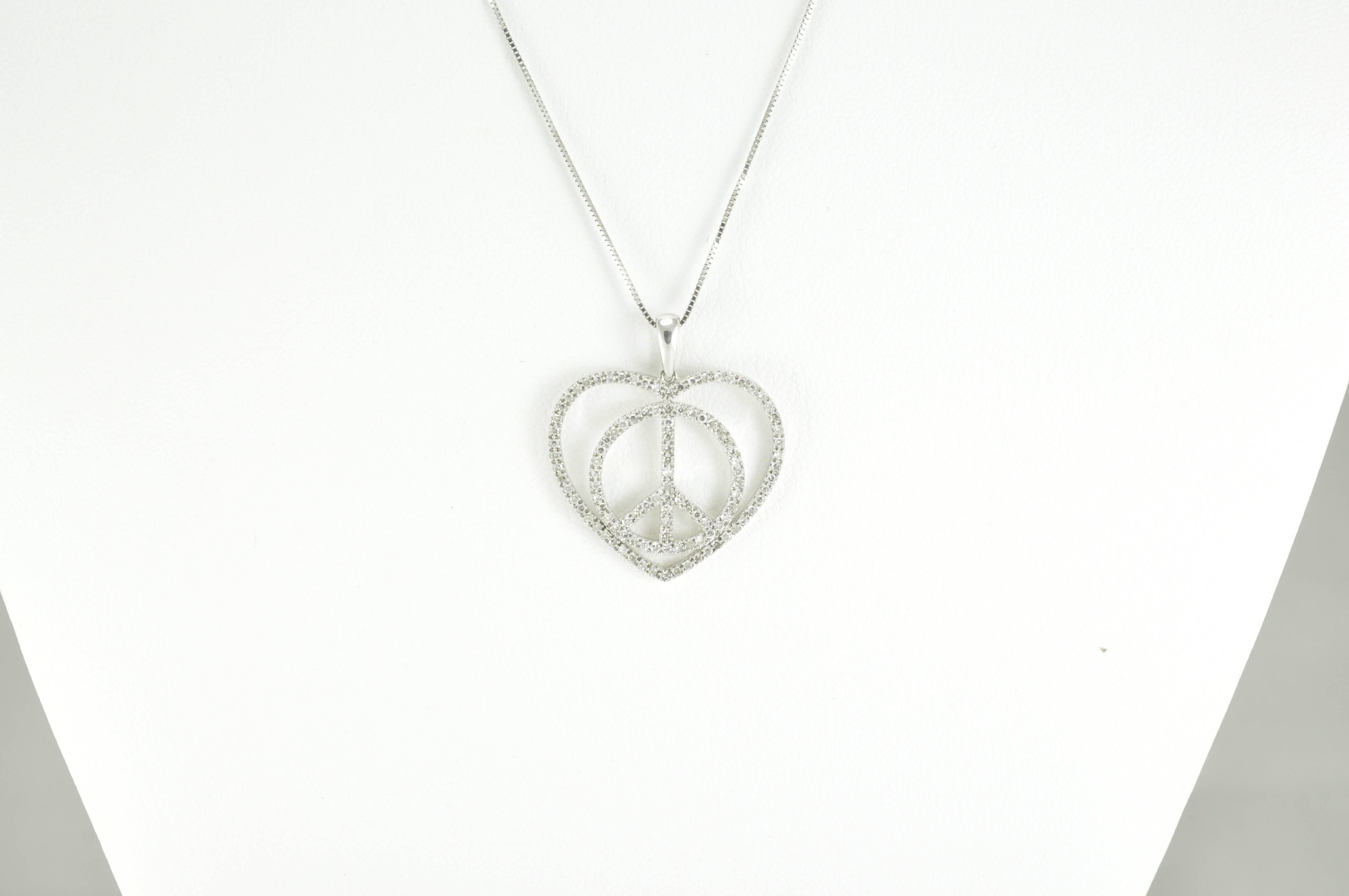 14k White Gold 0.50ct Round Brilliant Diamond Heart surrounding a Peace symbol Pendant on a 16 inch, small box-style chain. Chain is stamped 14k and ITALY. The pendant is stamped 14kSR. The pendant itself measures just over 1 inch tall, 7/8 inch