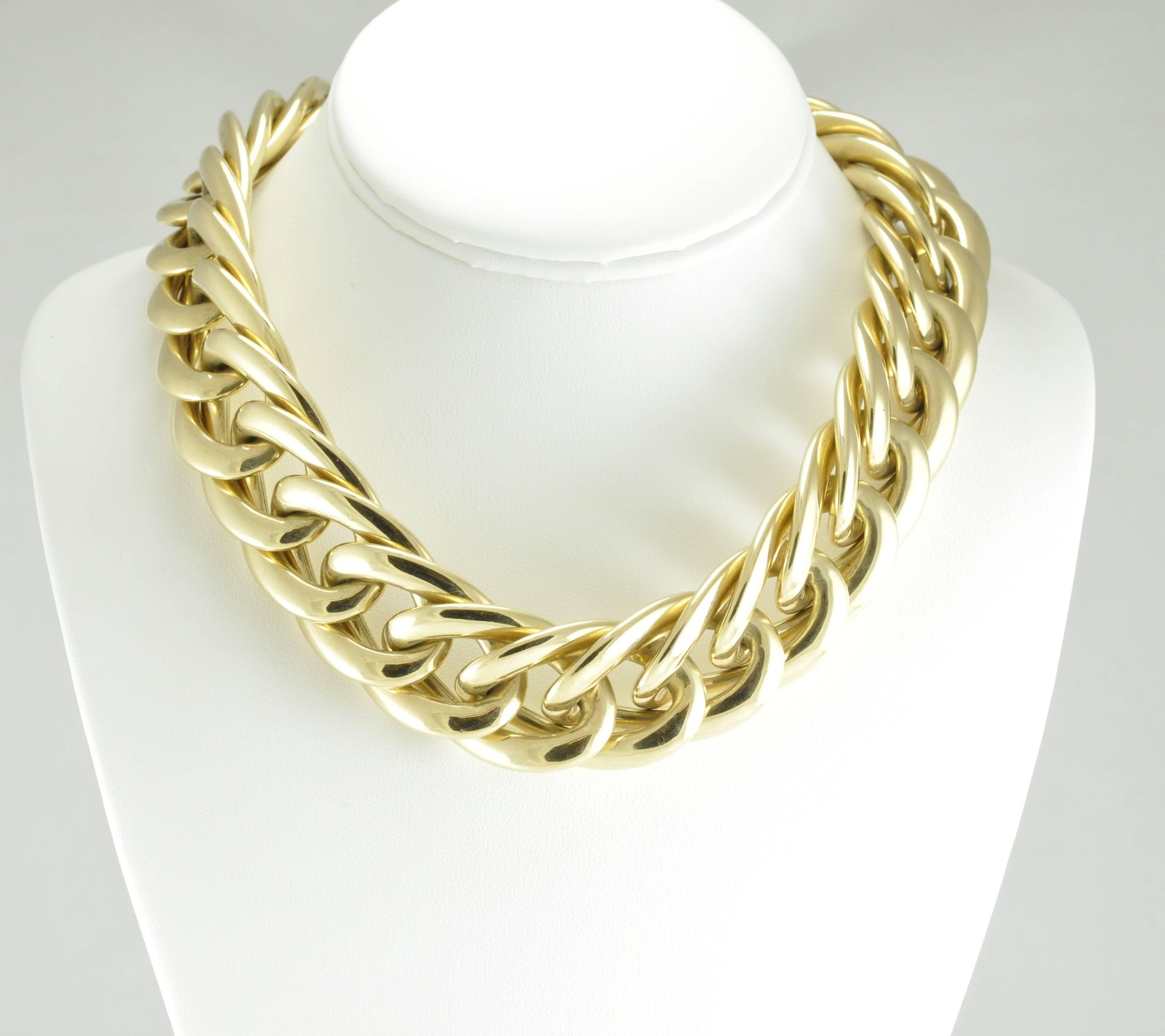 14k Yellow Gold Stamped 14k inch, Wide Link Necklace. Each link measures 1 inch wide and 1.5 inches long. The necklace has a double safety catch closure. The clasp is stamped ITALY and CI, however, the manufacturer is unknown.
As the links are