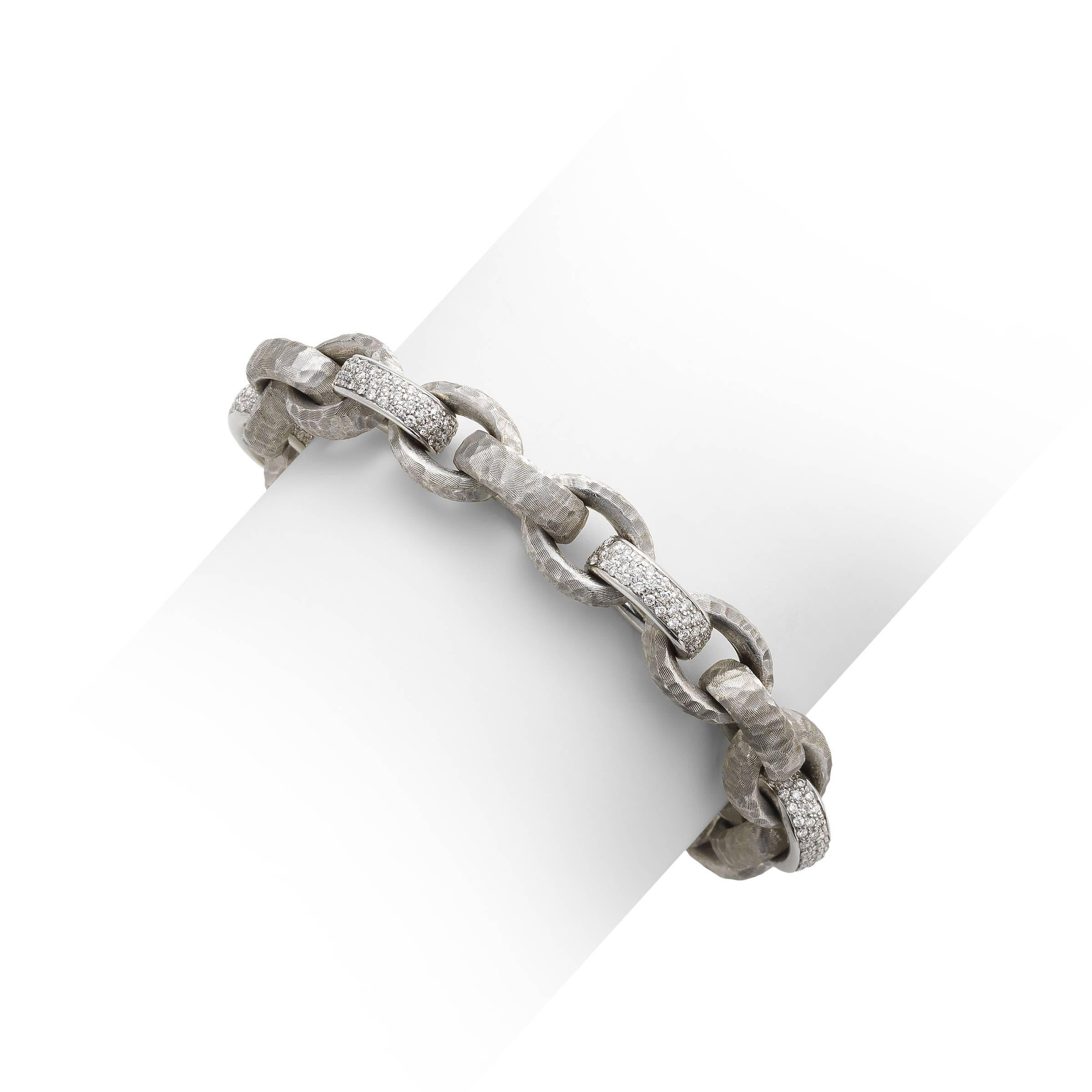 18k White Gold Textured and Diamond Link Bracelet. Designed by Nicolis-Cola. This item is stamped Nicolis-Cola, 18k and ITALY.
