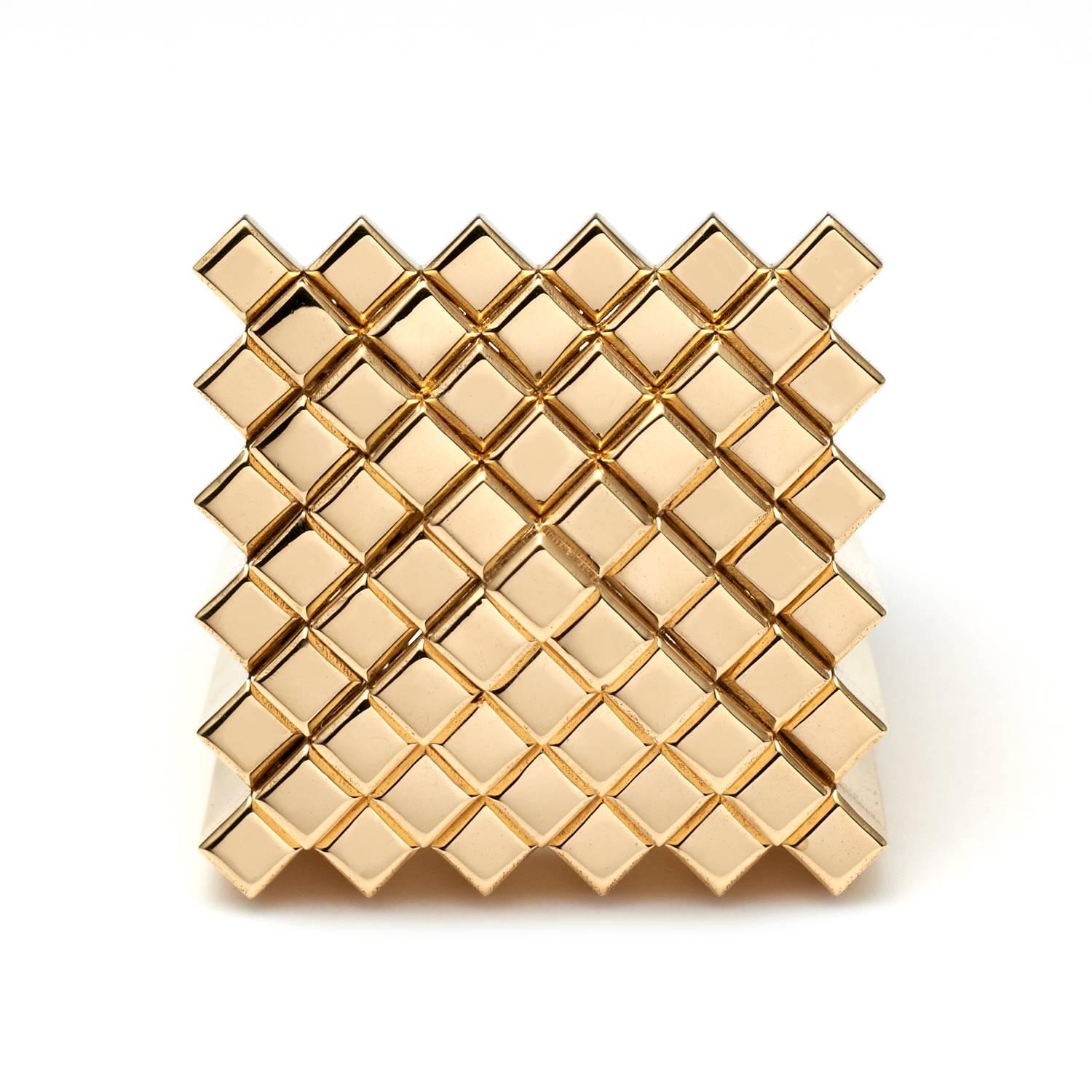 Polished 18ct. yellow gold "Pyramid Pixel" ring by Francesca Grima

French Size 53  UK Size M  U.S. Size 6 1/4

Signed Francesca Grima

About Francesca Grima 
Born into a family that has a long tradition in fine jewellery – her great-great