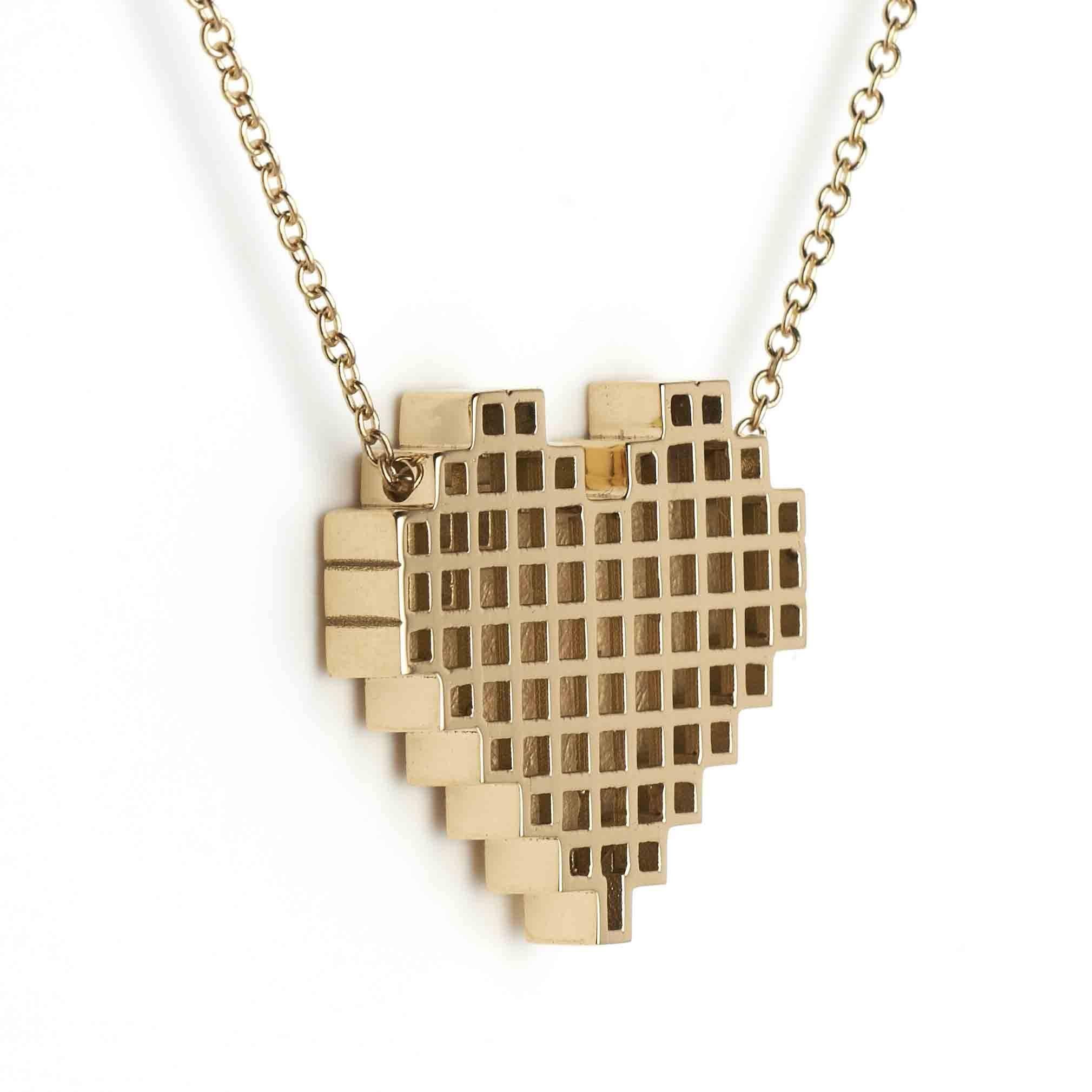 Yellow Gold and Diamond Pixel Heart Necklace by Francesca Grima 

18ct. Yellow Gold set with 3 Diamonds on Yellow Gold Chain.

・Polished 18ct. Yellow Gold
・3 Princess-cut Diamonds (0.05cts)
・Pendant length: 2cm
・Pendant width; 2.1cm
・Chain can be