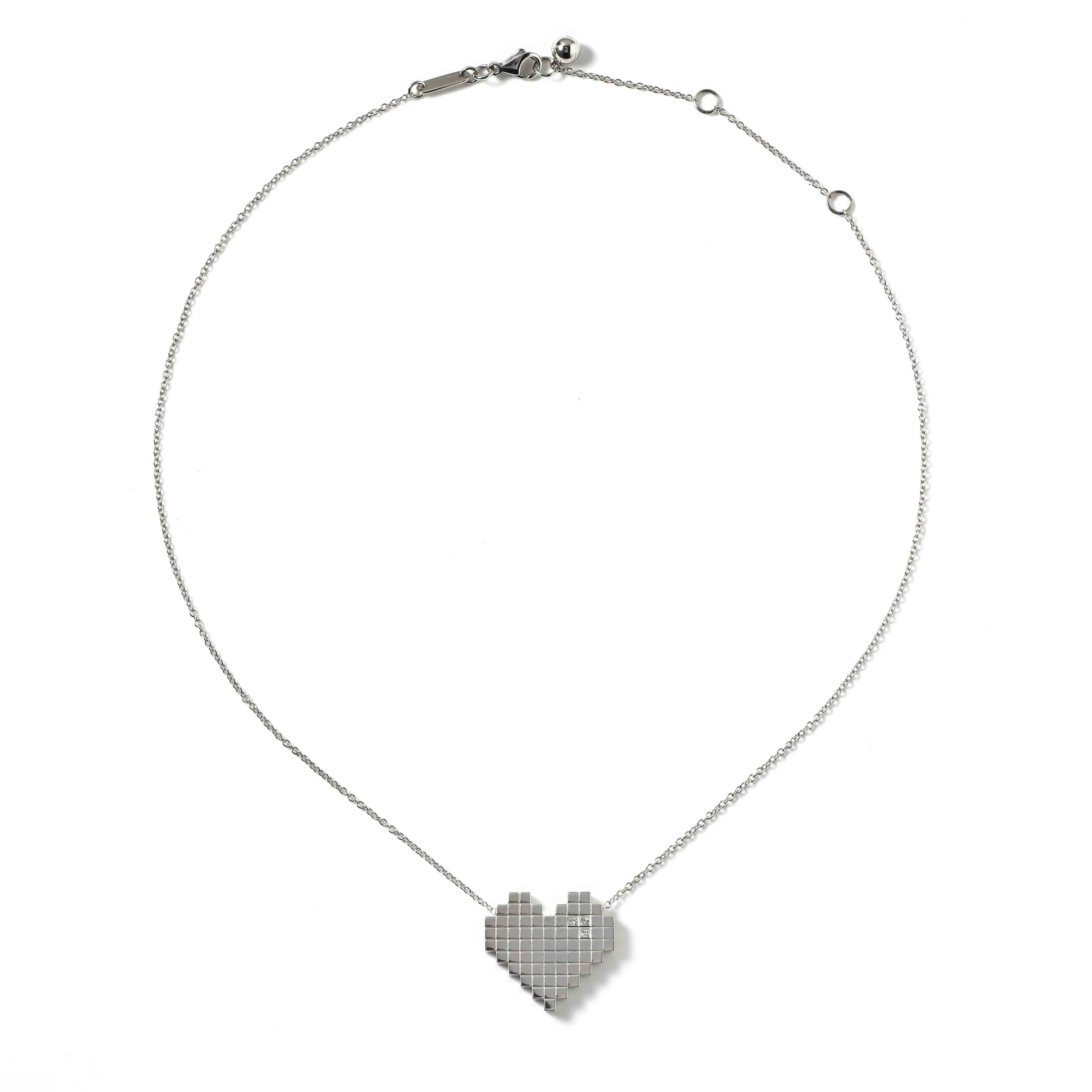 White Gold and Diamond Pixel Heart Necklace by Francesca Grima 

18ct. White Gold set with 3 Diamonds on White Gold Chain.

・Polished 18ct. White Gold
・3 Princess-cut Diamonds (0.05cts)
・Pendant length: 2cm
・Pendant width; 2.1cm
・Chain can be worn
