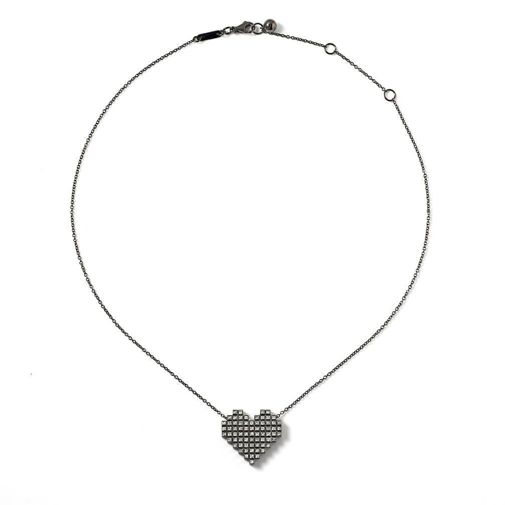 Black Gold and Diamond Pixel Heart Necklace by Francesca Grima 

18ct. Black Gold set with Diamonds on Black Gold Chain.

・Polished 18ct. Black Gold
・70 Princess-cut Diamonds (0.88cts)
・Pendant length: 2cm
・Pendant width; 2.1cm
・Chain can be worn in