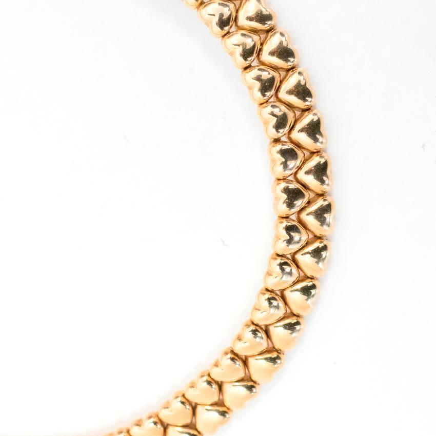 Cartier 18k Yellow Gold Heart Collar Necklace. 

Timeless interlocking heart design in a close-fitting style featuring a subtle fastening.

Condition: 9.5/10. Hairline signs of wear to the gold. 

Measurements Approx:

length - 38cm
height - 1.25cm