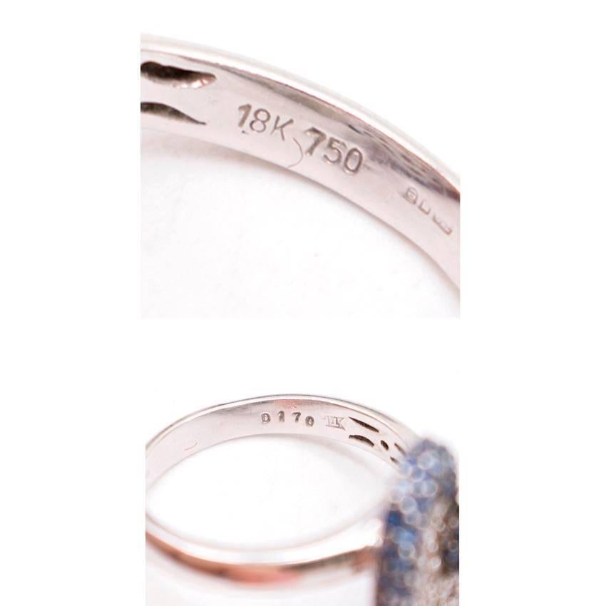 Bespoke pink and blue 18K white gold diamond ring.
Circular inlaid brilliant cut diamonds
hallmarked 18KT gold 2005 date letter 

18K White gold. 
Two matching love heart rings. 

Fabric:  18K White Gold/Diamonds. 
Size: One Size. 
Label Details: