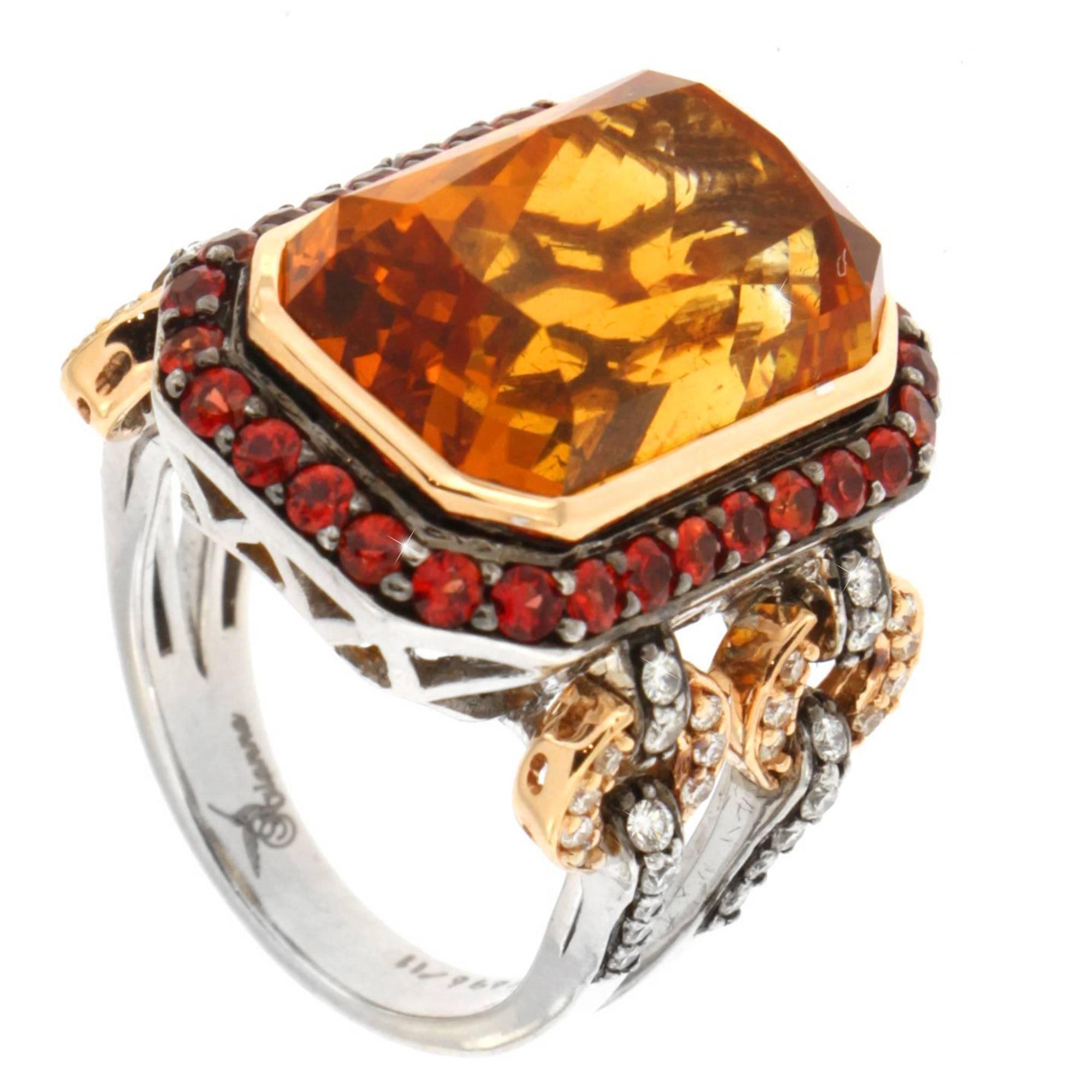 Absolutely eye catching bright orange emerald cut citrine surrounded by pave set red sapphires. This modern and bold design is accentuated with circles of  rose gold an shimmering diamonds on the sides. This ring is a size 7 and can be sized

 