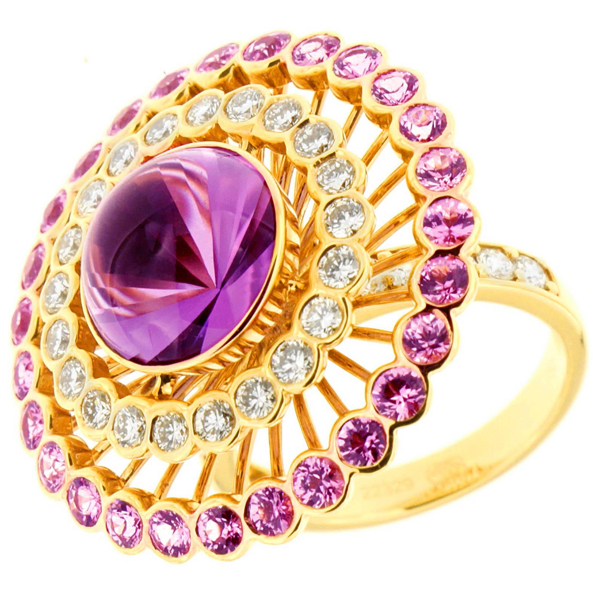 Large center amethyst 5.62 ct is surrounded by 1.65 cts diamonds in the inner circle. The outed circle is 2.87 cts pink sapphires. All in 18 kt yellow gold.
An absolutely spectacular ring.