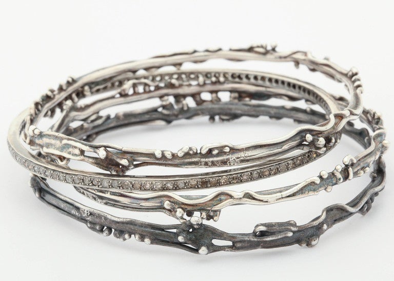 Artisan Set of Artistic Silver and Diamond Bangle Bracelets For Sale