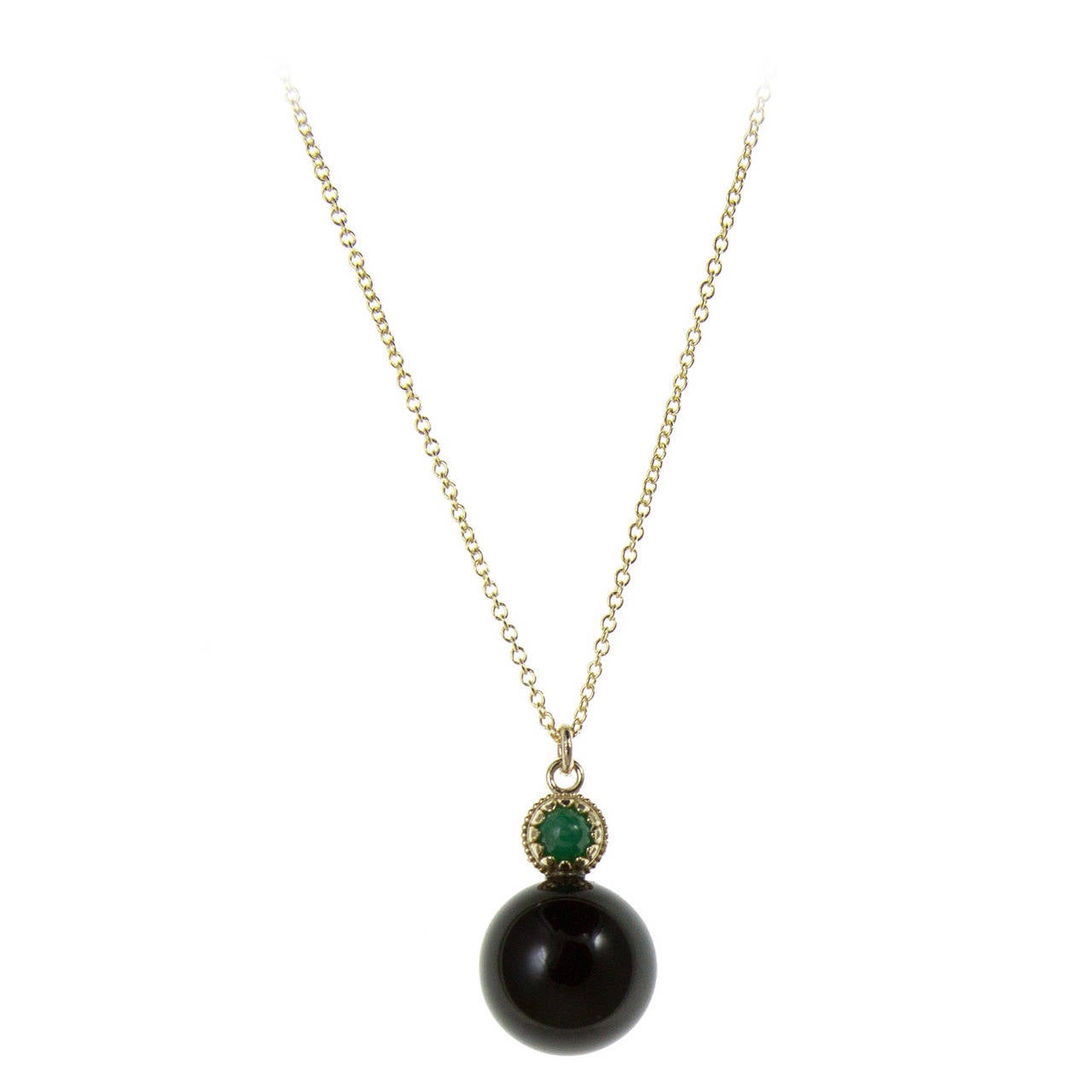 Black Onyx Bead with Emerald Cabochon in 14k Yellow Gold For Sale