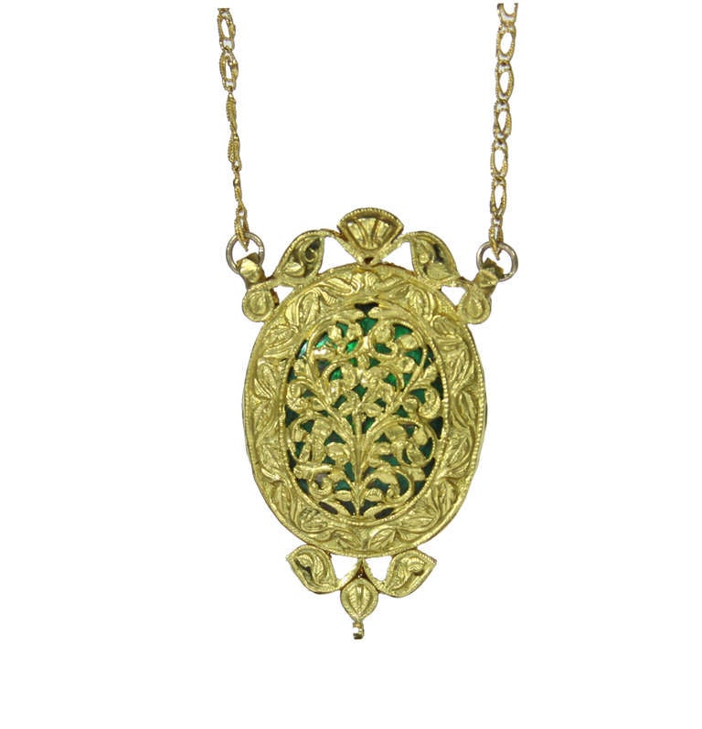 Mughal Style Indian Turquoise Pendant with Rose Cut Diamonds  and Rubies set in Gold by Amyn The Jeweler ™

The back shows beautiful intricate gallery and repousse work.

Recreation of Jewelry worn by The Mughal's who ruled India from the early