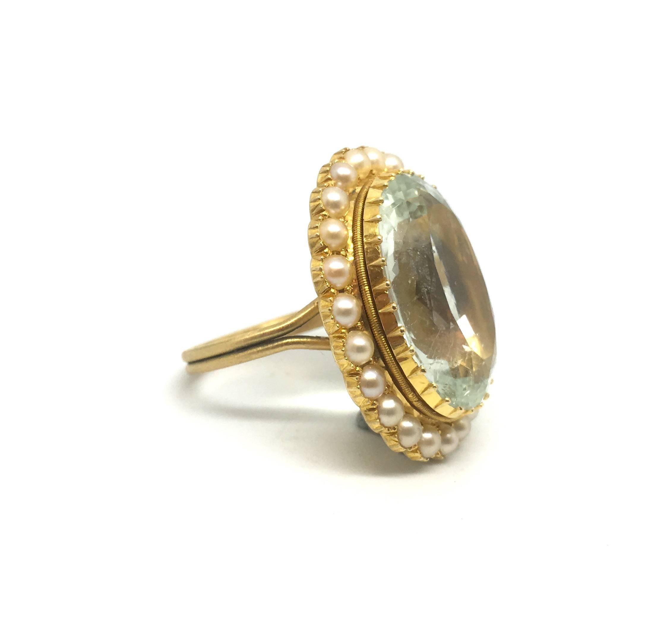 A substantial aquamarine and pearl ring.

Converted from a Victorian brooch with the addition of an 18ct gold under-gallery and band. 

The pale blue aquamarine weighs approximately 18-20cts. 

The face of the ring measures 28 x 23mm approximately.