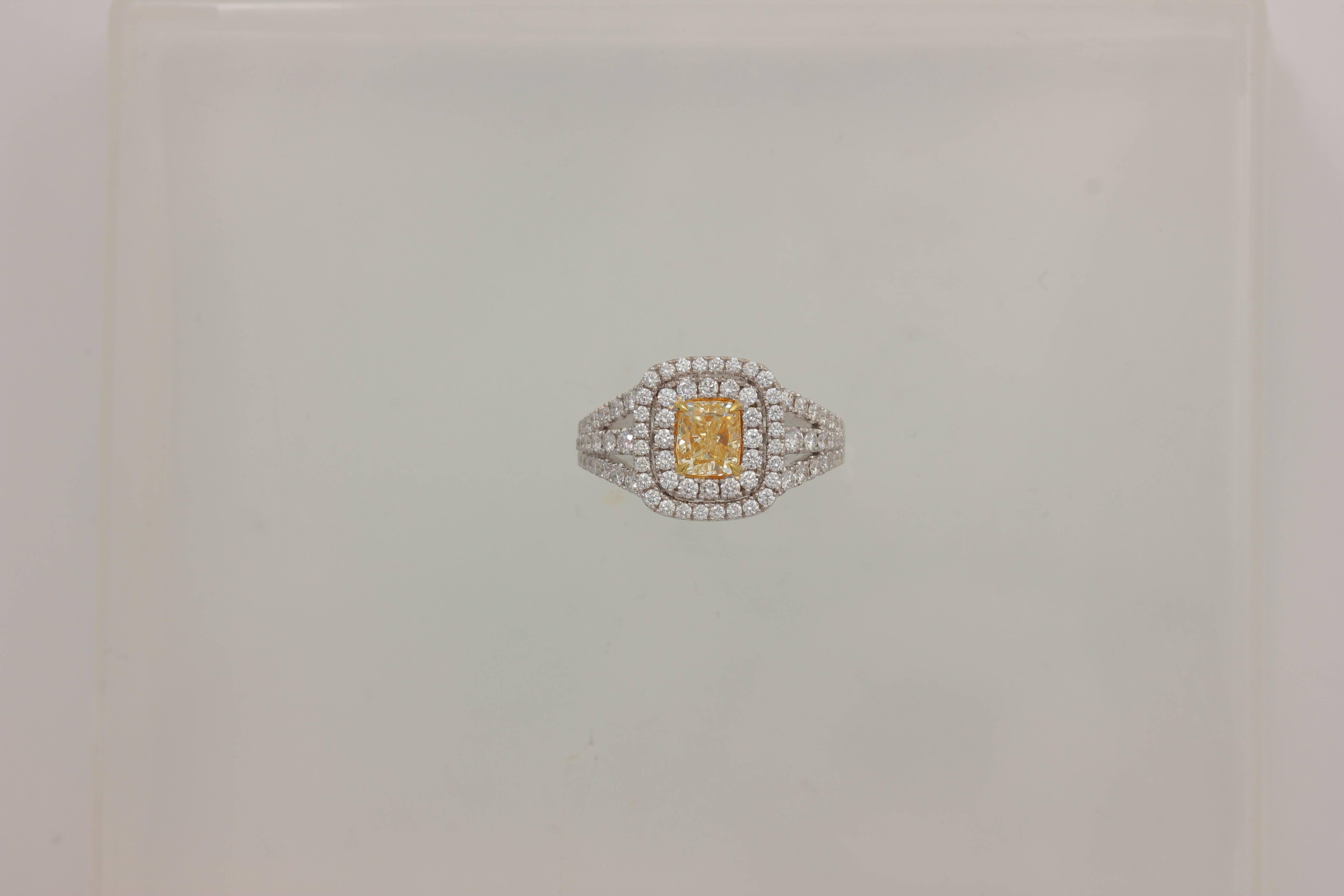 18K White Gold CUSHION YELLOW DIAMOND DOUBLE HALO WITH TRIPLE DIAMOND SHANK AND PRONGS One of Kind Ring
YELLOW DIA 1.19 Carats
2 Diamonds 0.05 Carats, 86 Diamonds 0.94 Carats